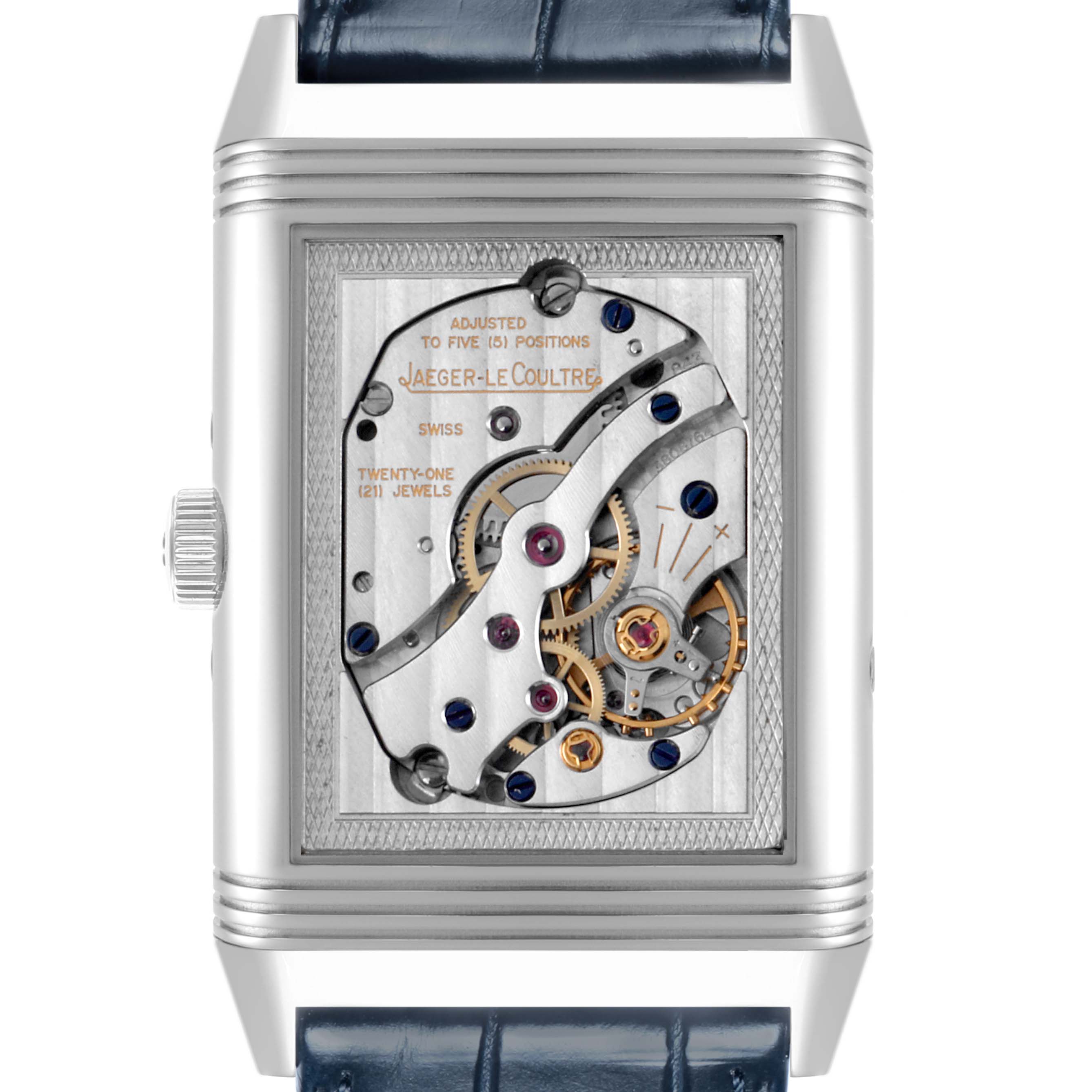The image shows a Jaeger-LeCoultre Reverso model watch from the front, displaying its intricate movement.