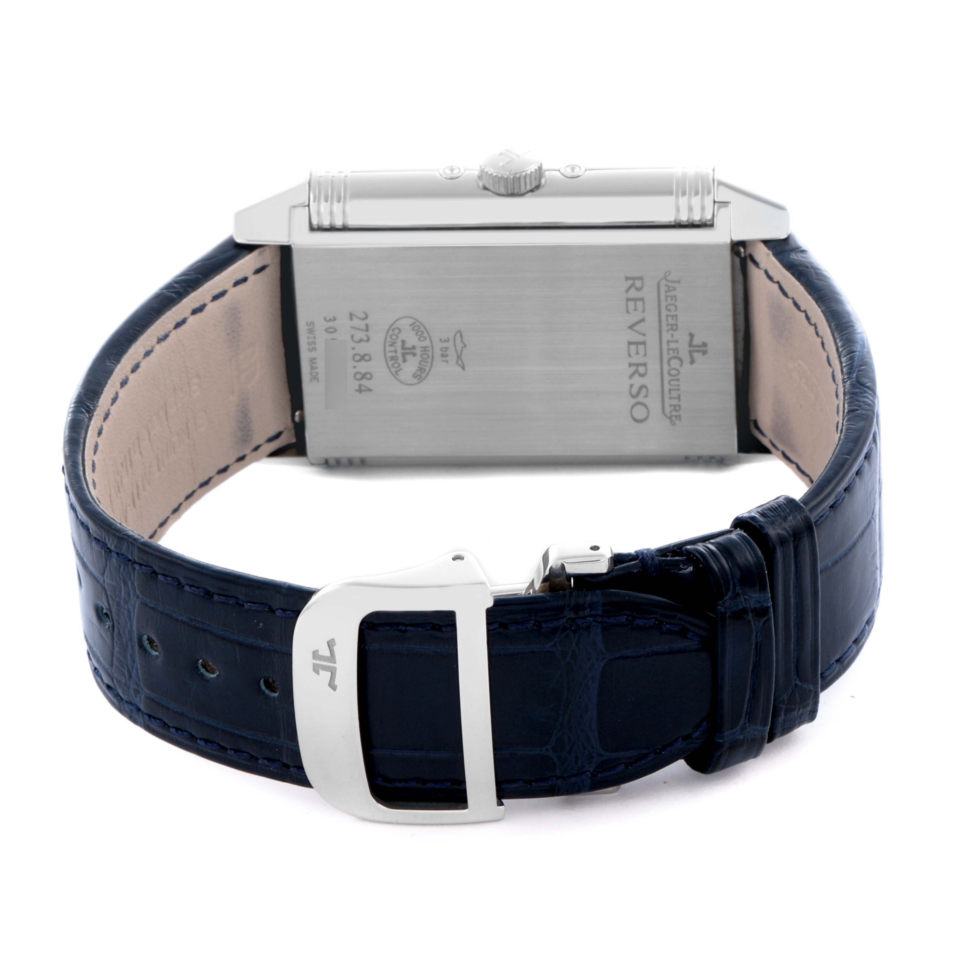 The image shows the back of a Jaeger LeCoultre Reverso Q3758420 Men's Stainless Steel Silver Dial Q3758420 Men's Stainless Steel Silver Dial watch, focusing on the case back, crown, and blue leather strap with clasp.