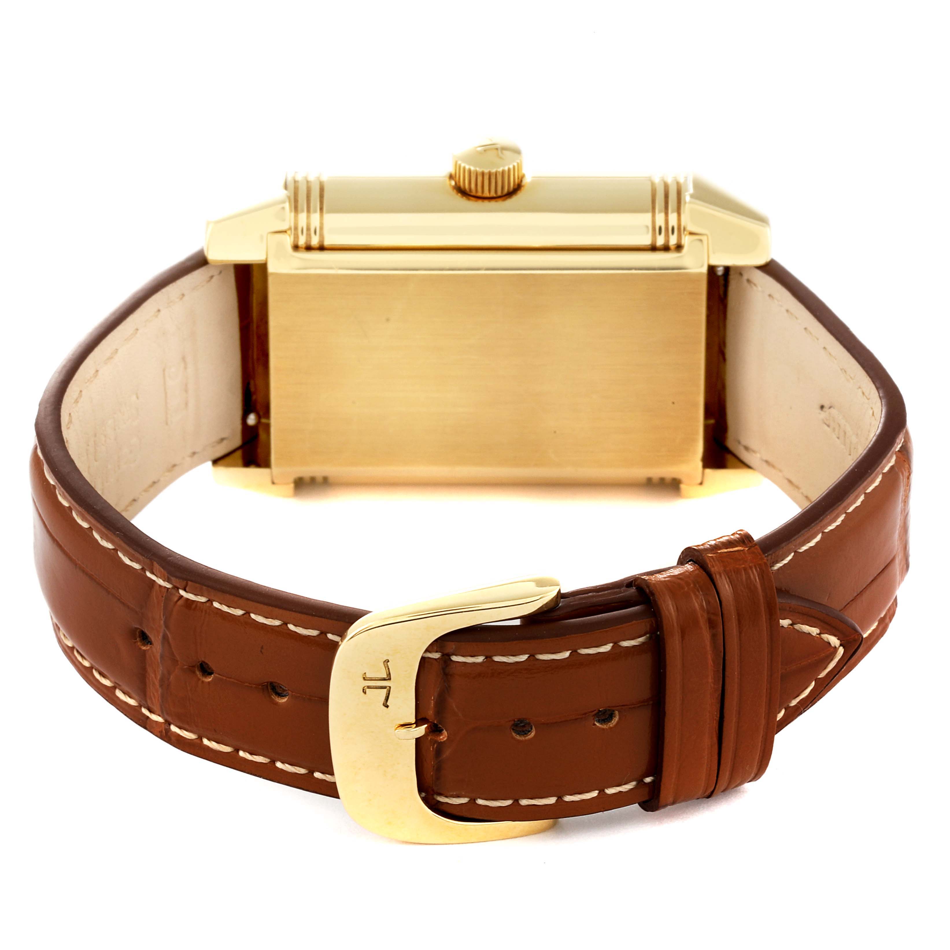 The image shows the back view of a Jaeger LeCoultre Reverso Q3001420 Men's Yellow Gold Silver Dial Q3001420 Men's Yellow Gold Silver Dial watch, highlighting its brown leather strap and gold buckle.
