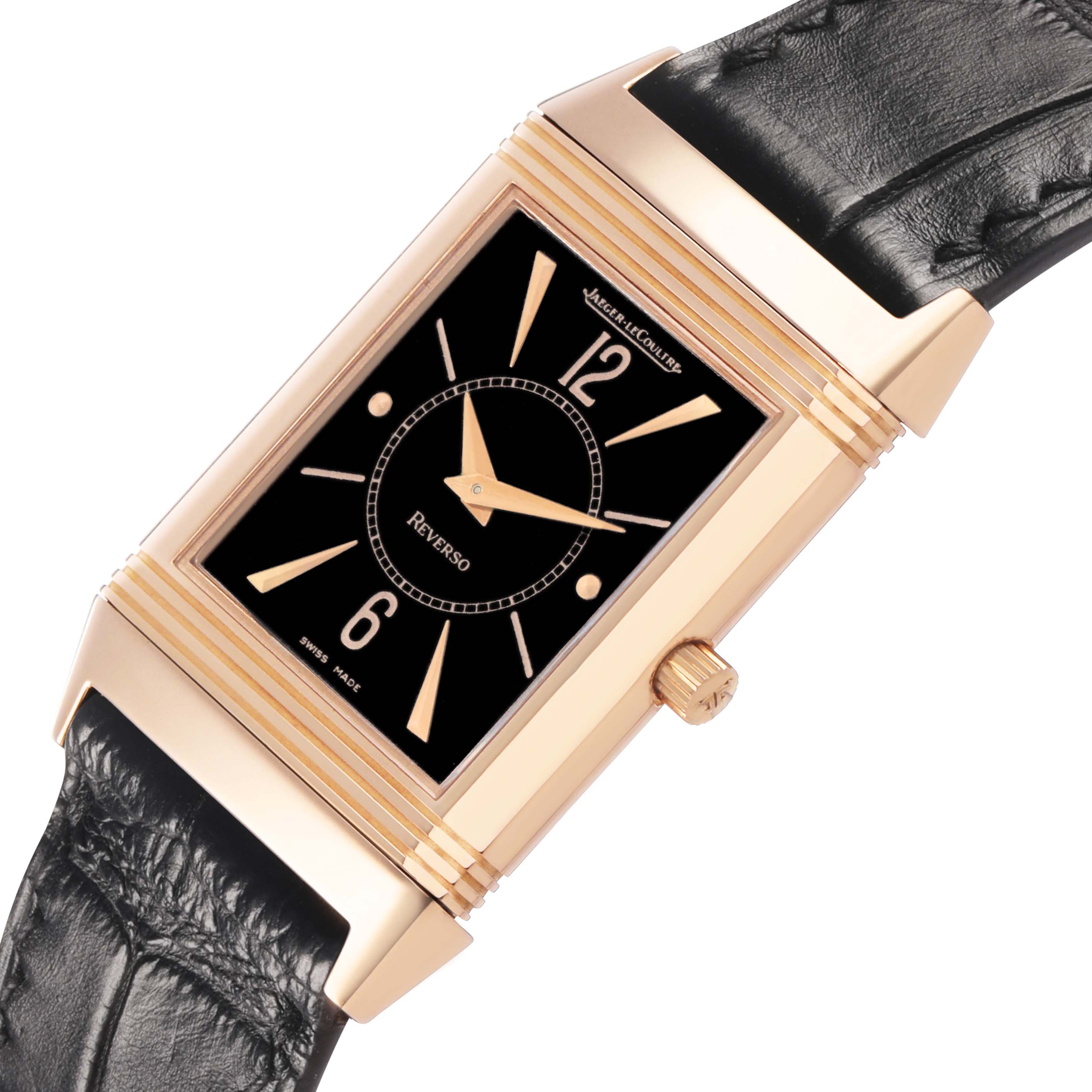 The image shows a Jaeger-LeCoultre Reverso watch from a high angle, highlighting the gold case, black dial, and black leather strap.