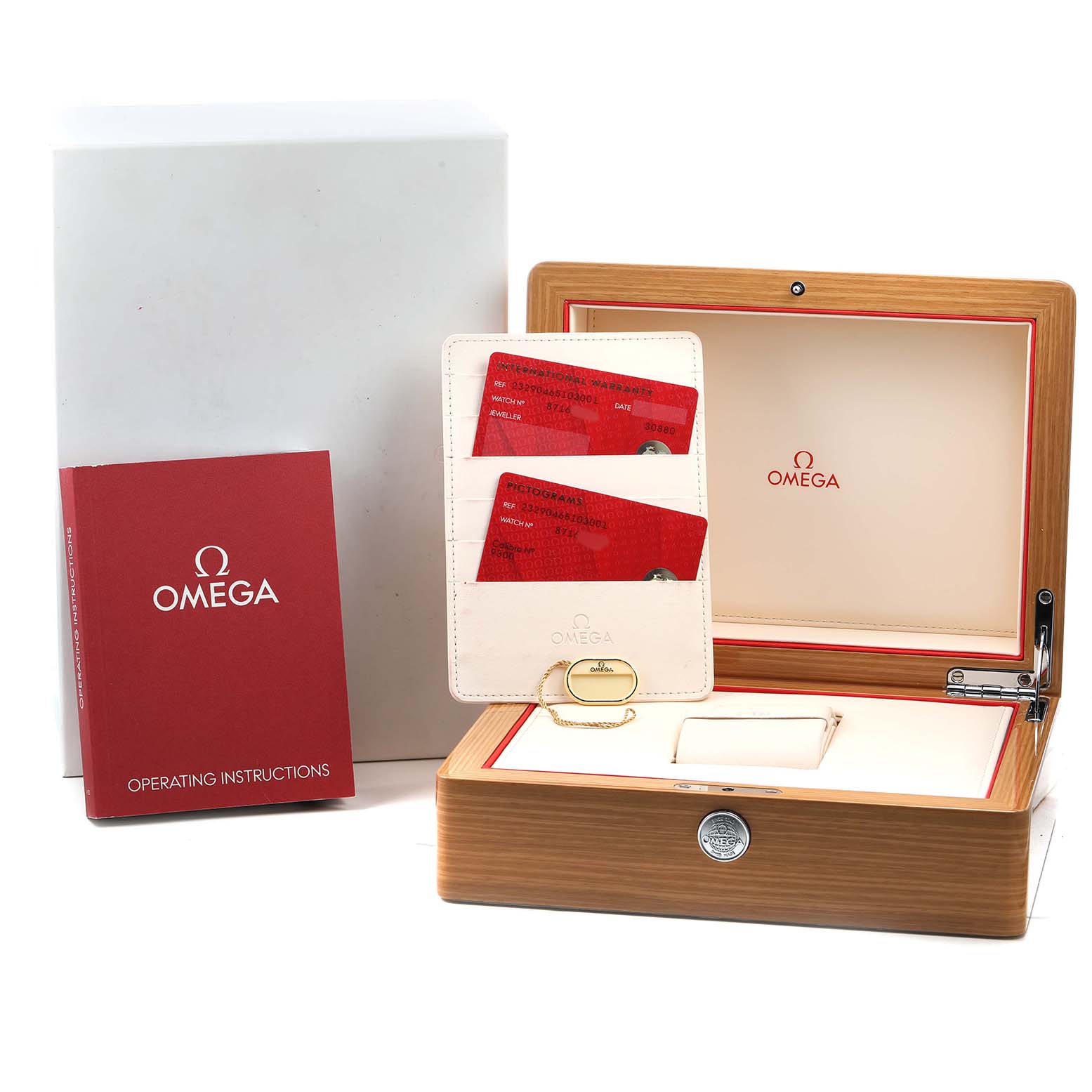 The image shows an Omega Planet Ocean 232.90.46.51.03.001 Men's Titanium Blue Dial model box set with a wooden case, warranty cards, and an operating instructions booklet.