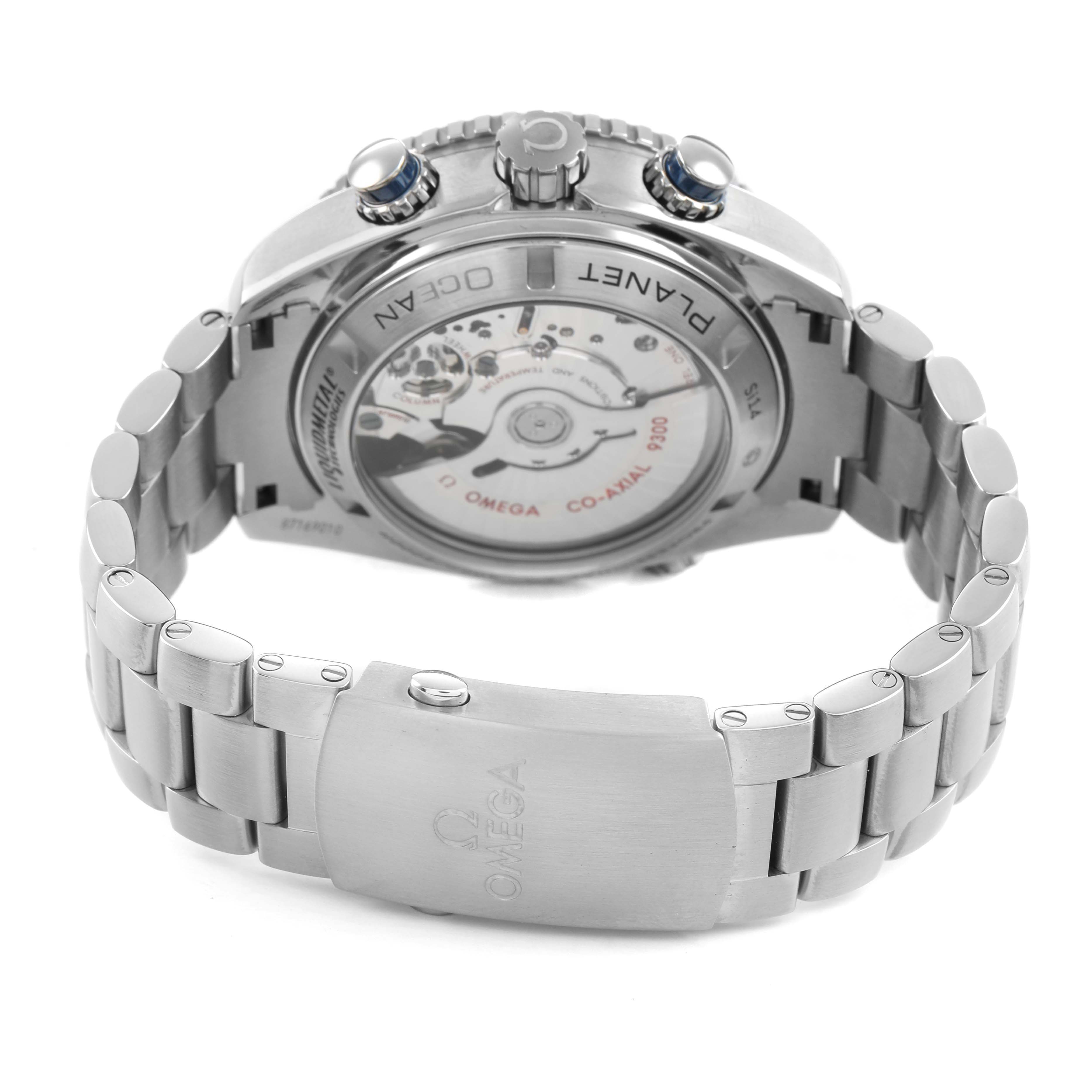 The Omega Planet Ocean 232.90.46.51.03.001 Men's Titanium Blue Dial watch is shown from the back, highlighting the transparent case back and metal bracelet.