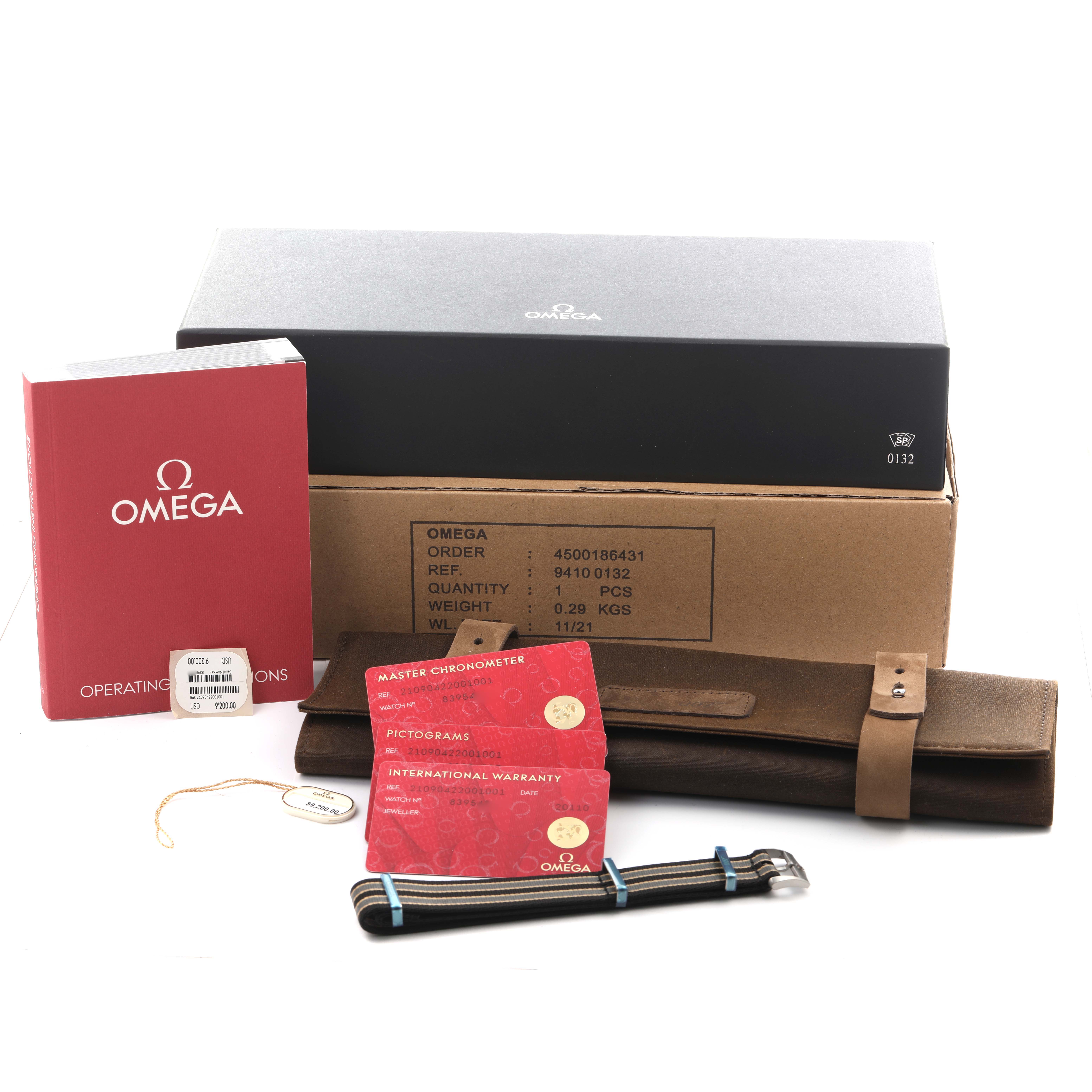 The image shows Omega Seamaster 210.90.42.20.01.001 Men's Titanium Brown Dial 210.90.42.20.01.001 Men's Titanium Brown Dial packaging, a manual, warranty cards, a strap, and a leather case, viewed from above.