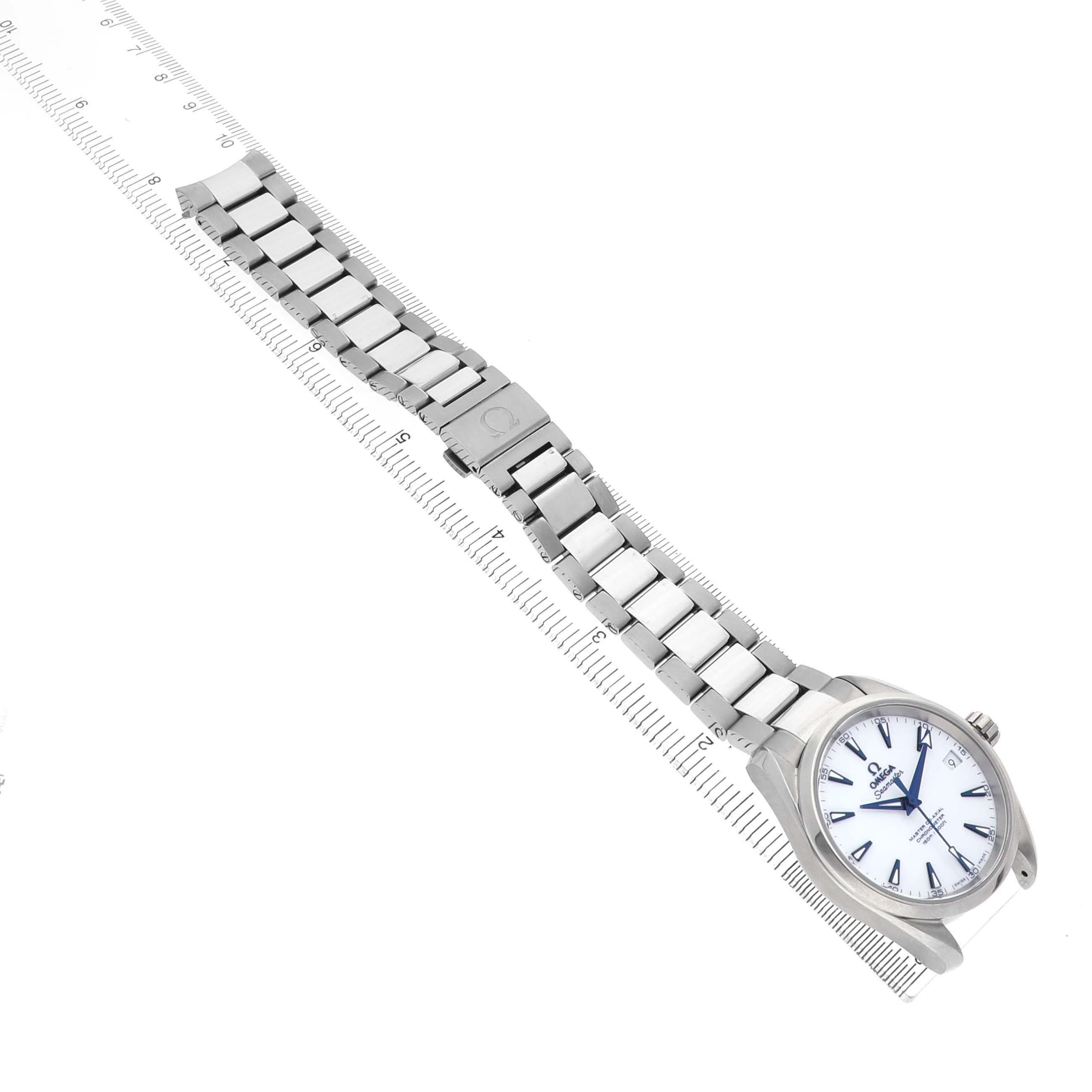 The Omega Aqua Terra 231.90.39.21.04.001 Men's Titanium Yellow Dial watch is shown at a slight angle, highlighting the face, bracelet, and clasp on a ruler for scale.