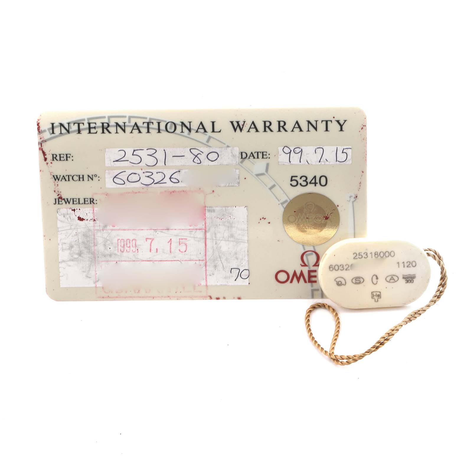 The image shows an Omega Seamaster 2531.80.00 Men
s Stainless Steel Blue Dial 2531.80.00 Men
s Stainless Steel Blue Dial international warranty card and a tag with reference numbers.