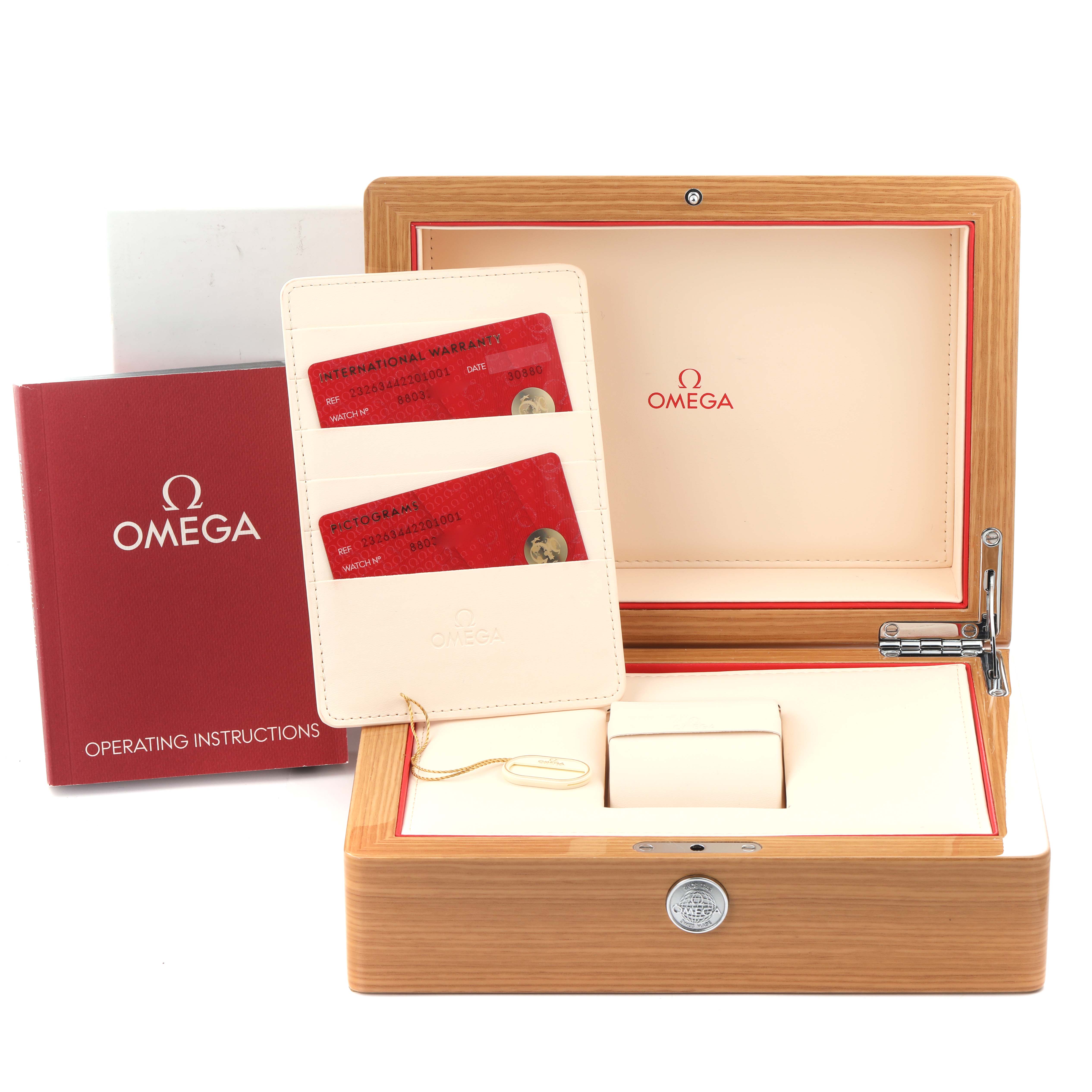 The image shows an open Omega Planet Ocean 232.63.44.22.01.001 Men's Rose Gold Black Dial 232.63.44.22.01.001 Men's Rose Gold Black Dial watch box with warranty cards and an operating instructions booklet.