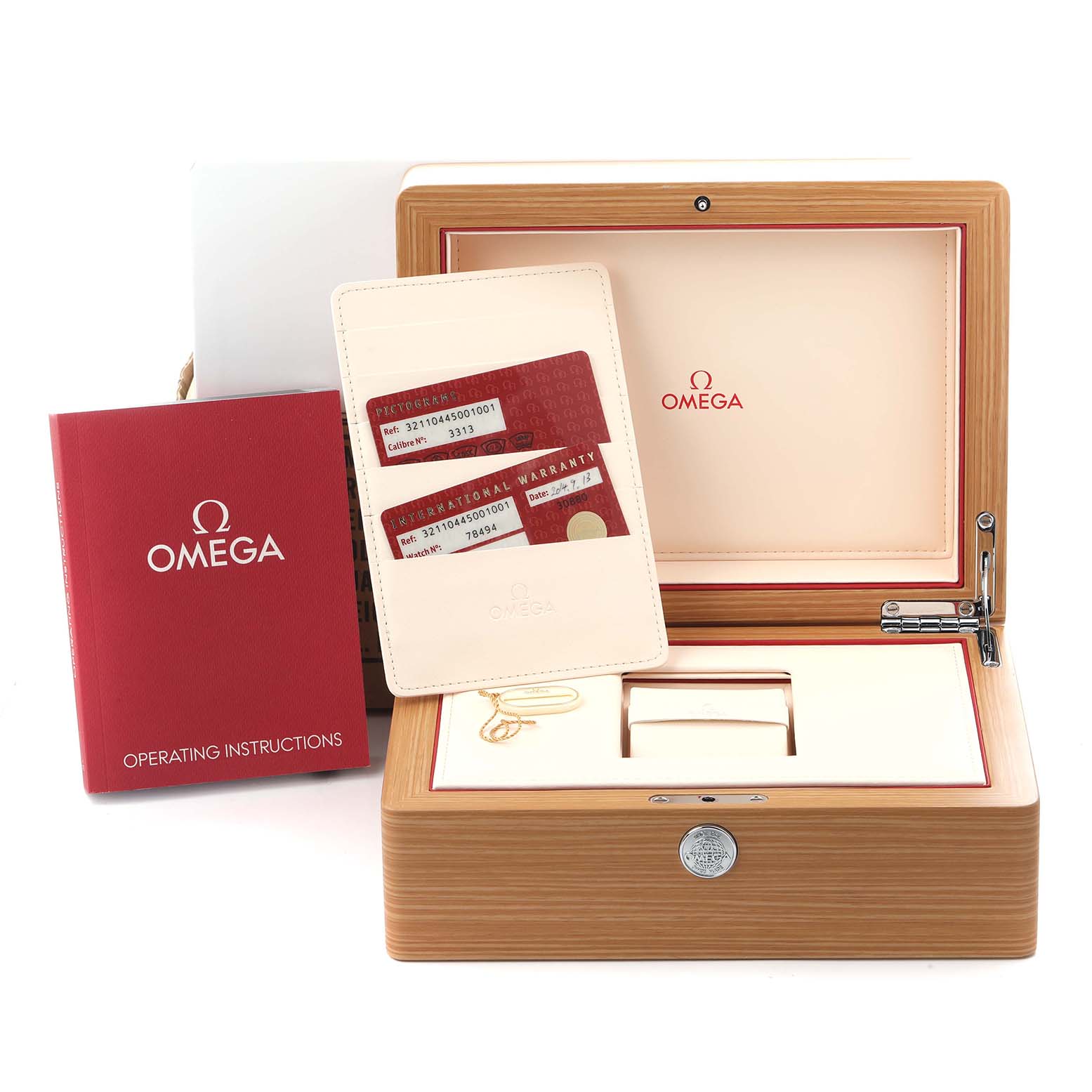 The image shows the Omega Speedmaster 321.10.44.50.01.001 Men
s Stainless Steel Black Dial 321.10.44.50.01.001 Men
s Stainless Steel Black Dial
s packaging, including the watch box, warranty cards, and operating instructions.