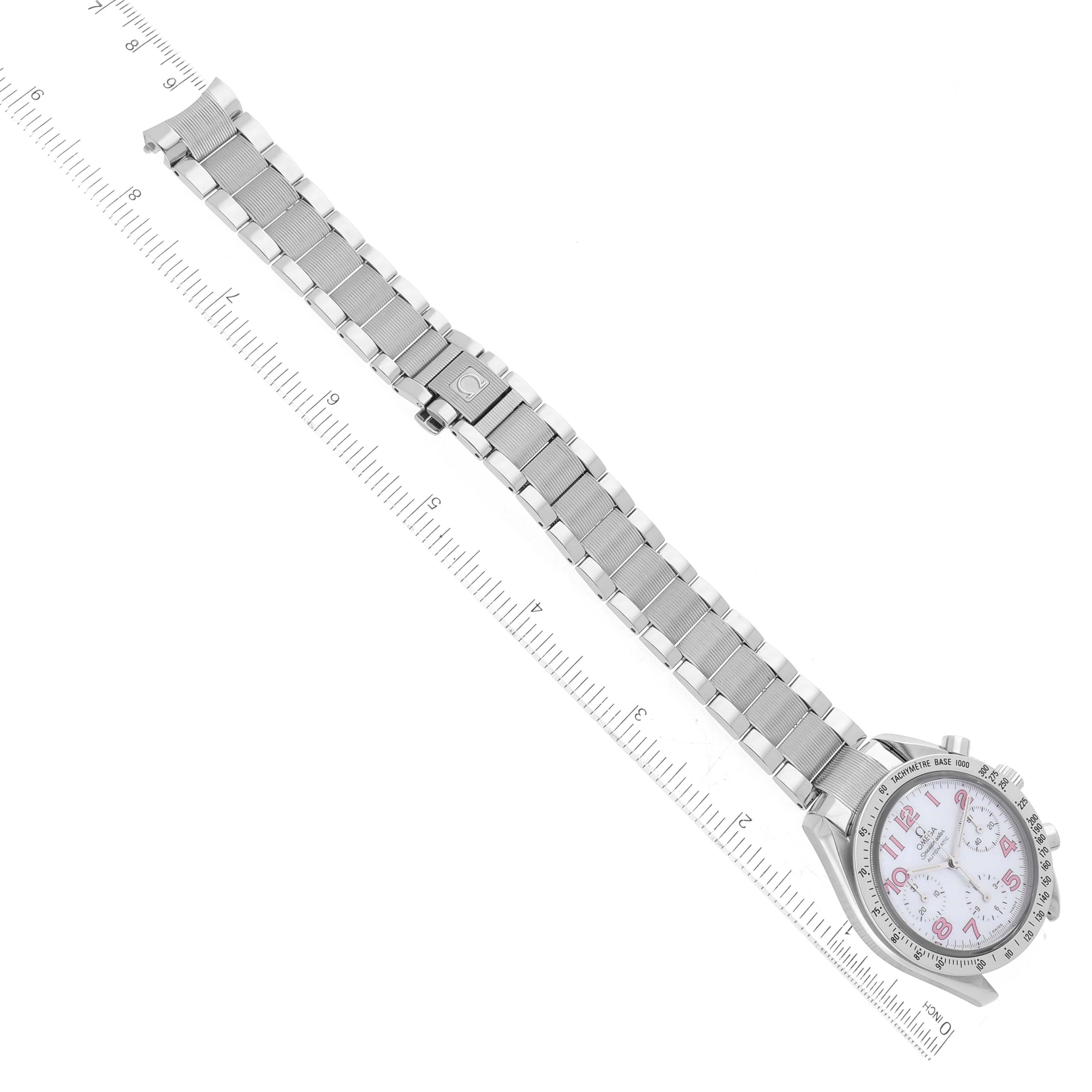 The image shows an Omega Speedmaster 3534.74.00 Men's Stainless Steel Mother of Pearl Dial 3534.74.00 Men's Stainless Steel Mother of Pearl Dial watch from a top-down angle, highlighting its bracelet, clasp, and face along with a ruler for scale.