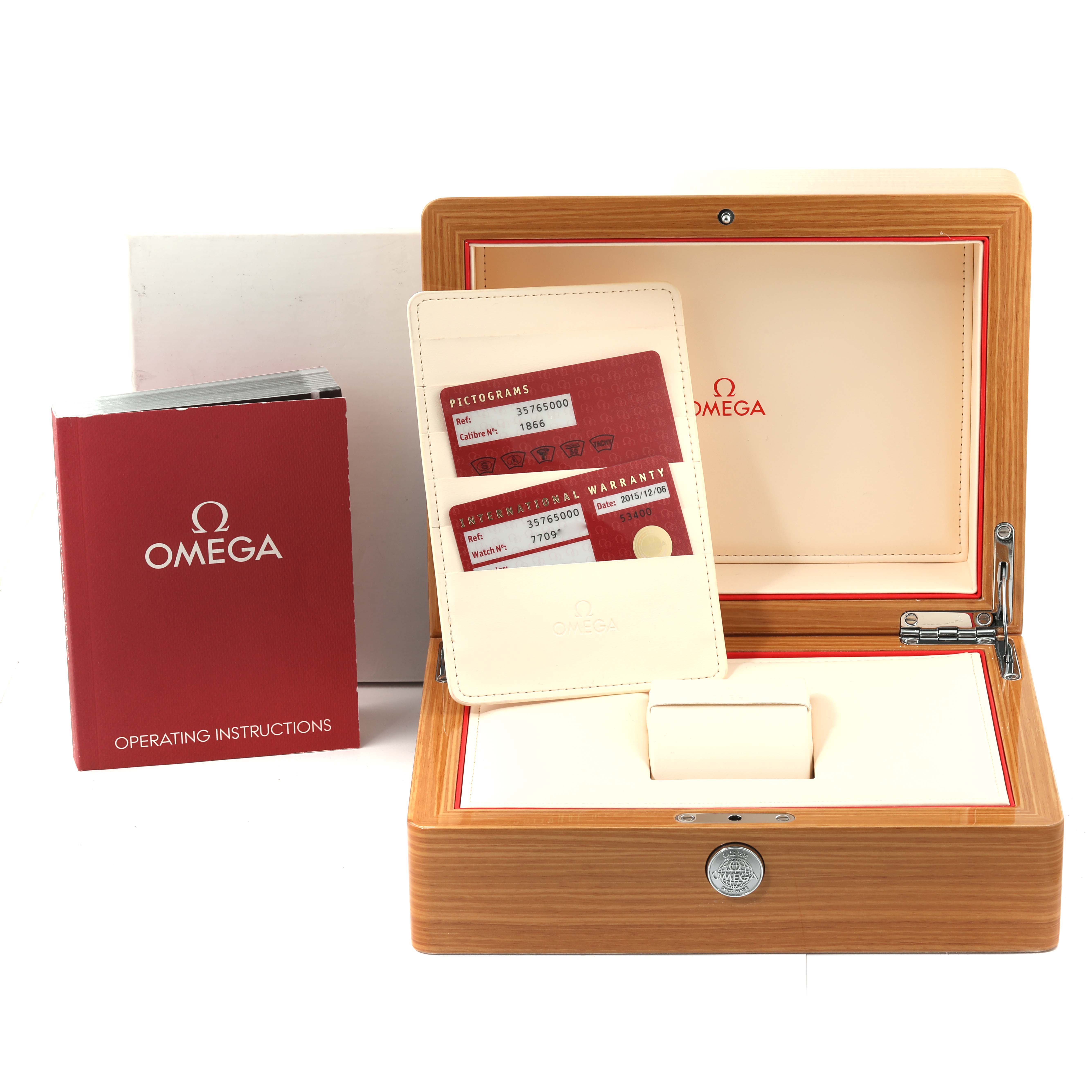 The image shows the Omega Speedmaster 3576.50.00 Men
s Stainless Steel Black Dial 3576.50.00 Men
s Stainless Steel Black Dial watch box, warranty cards, and operating instructions from a front angle.