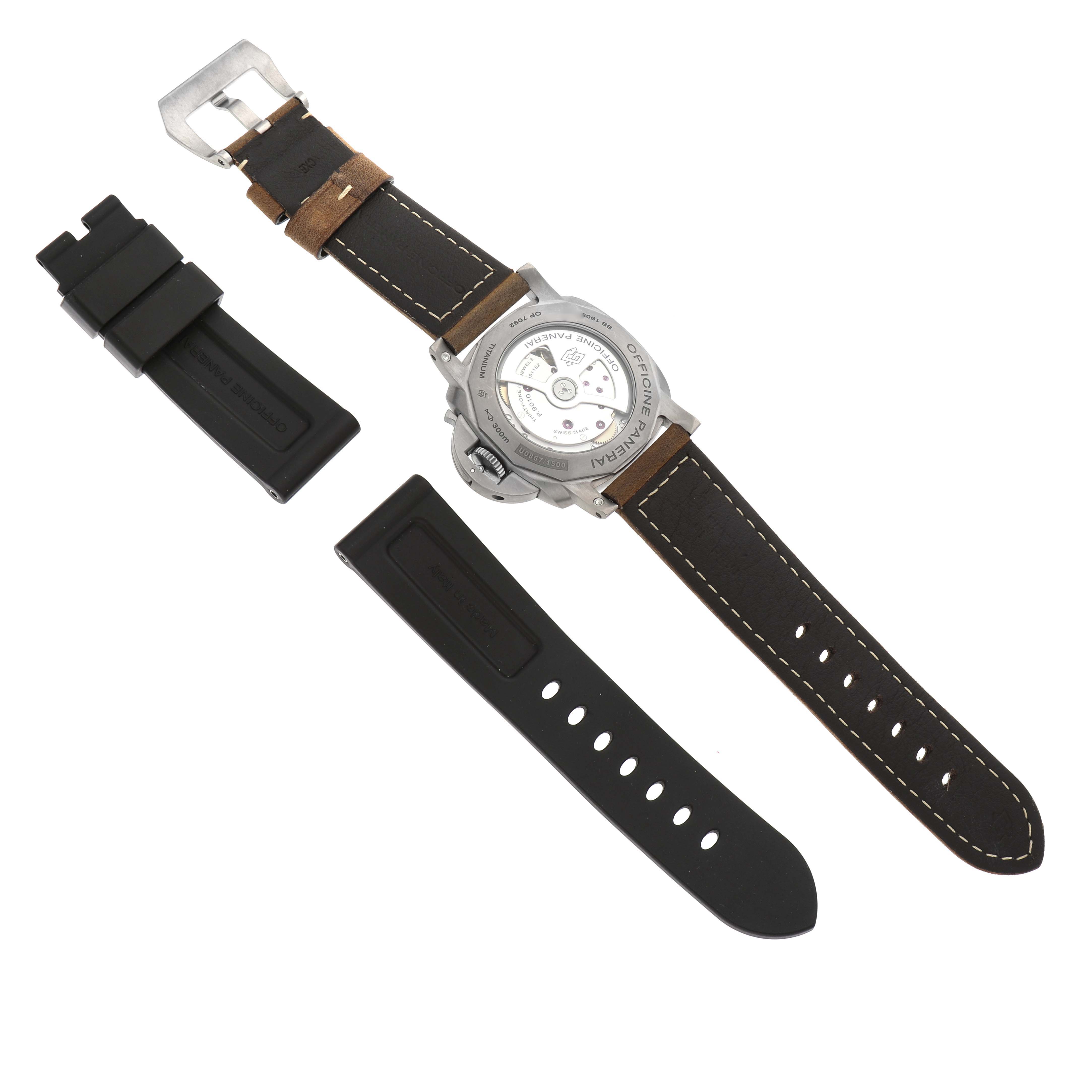 The image shows the back of a Panerai Luminor PAM01351 Men
s Titanium Brown Dial PAM01351 Men
s Titanium Brown Dial watch alongside its leather and rubber straps.