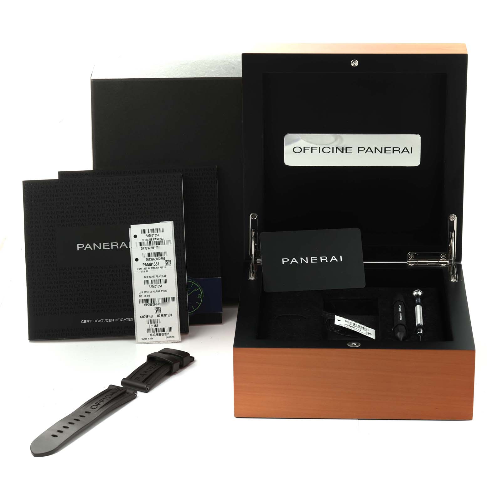 The image shows accessories for a Panerai Luminor PAM01351 Men
s Titanium Brown Dial PAM01351 Men
s Titanium Brown Dial watch, including a strap, tools, and documents, with the packaging box open.