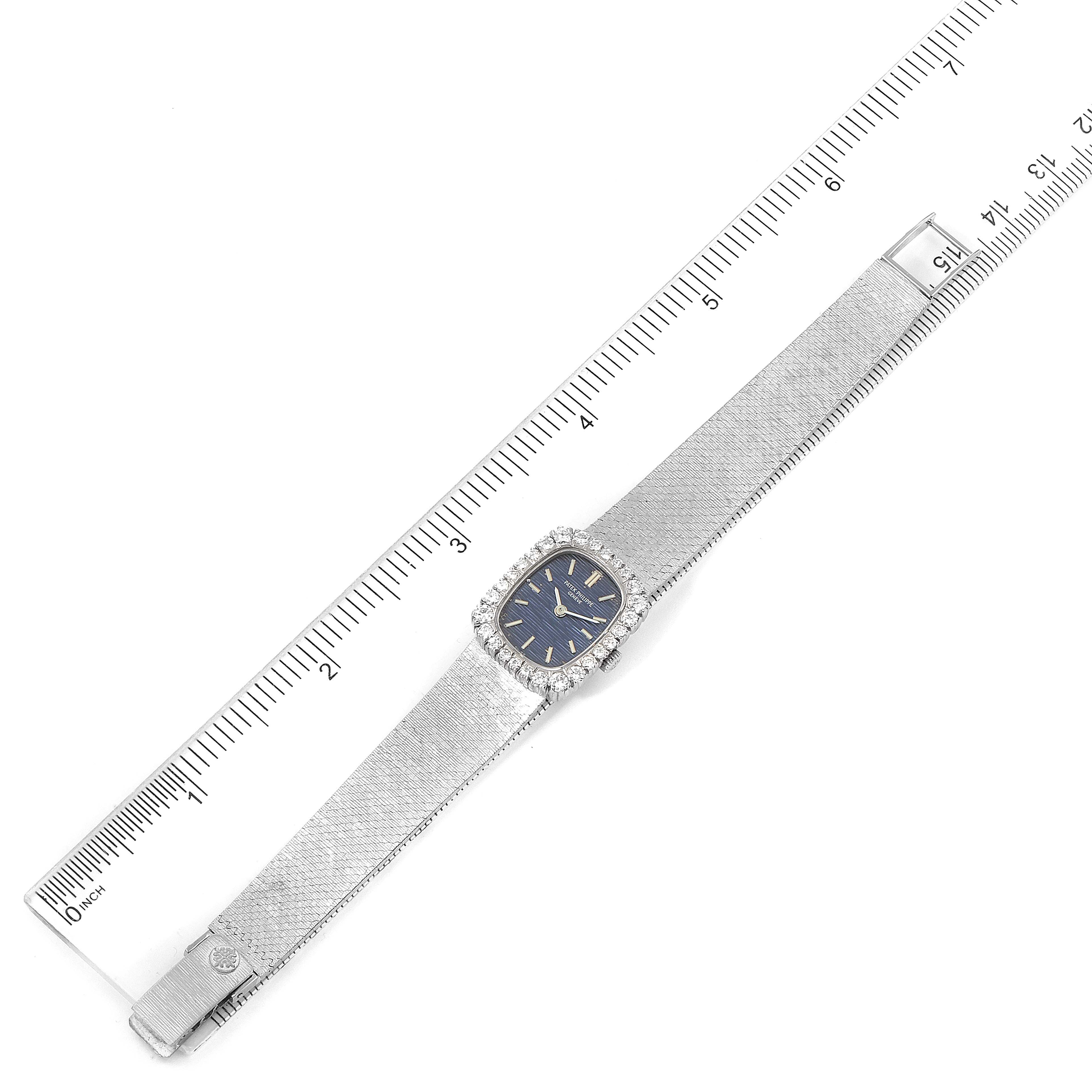 This image shows a top view of the Patek Philippe 4102 Women's White Gold Blue Dial 4102 Women's White Gold Blue Dial 4102 model, 18k White Gold Diamond Bezel Cocktail Ladies Watch, with a ruler for scale.