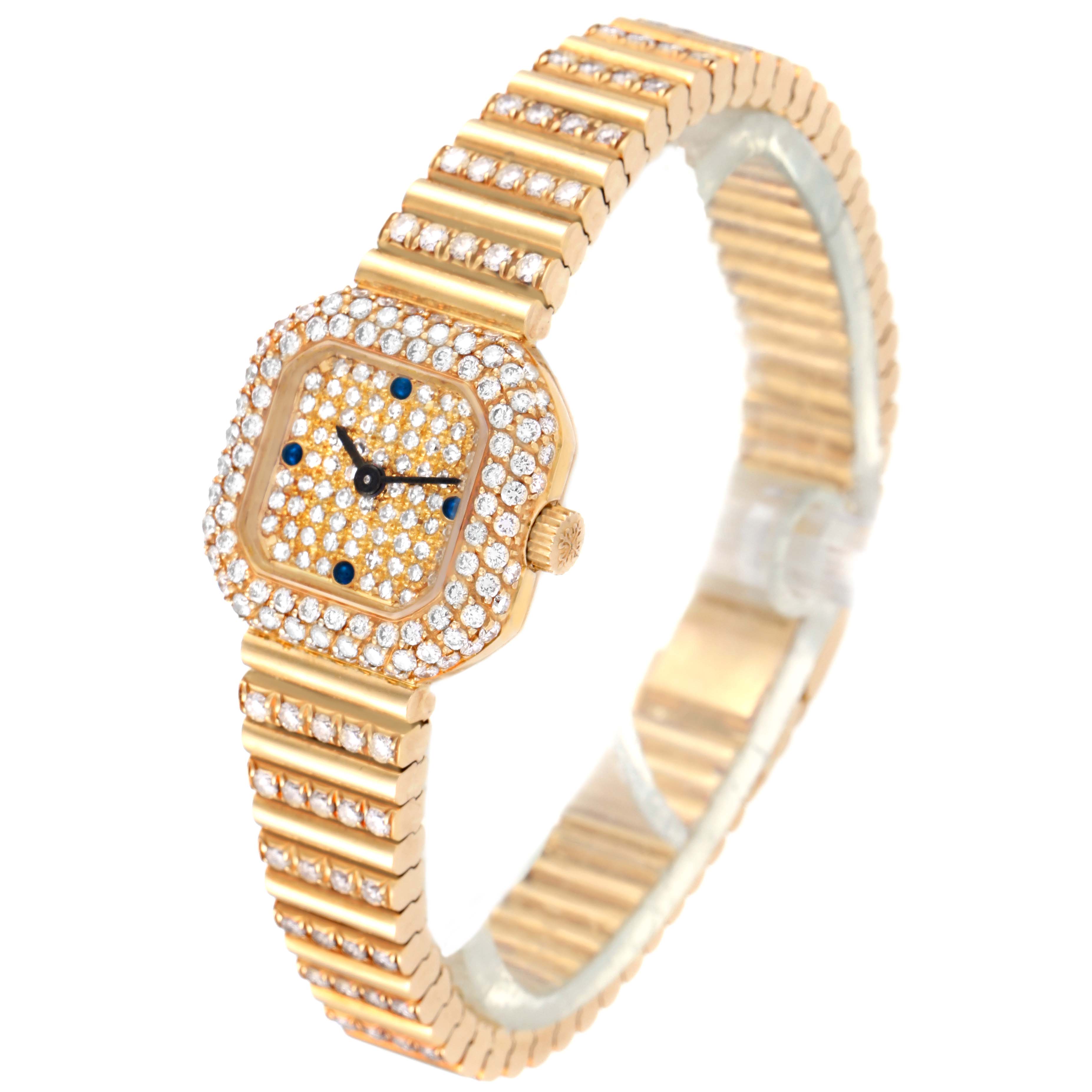 This image shows a Vintage Patek Philippe watch at a three-quarter angle, highlighting its gold and diamond-studded case and bracelet.