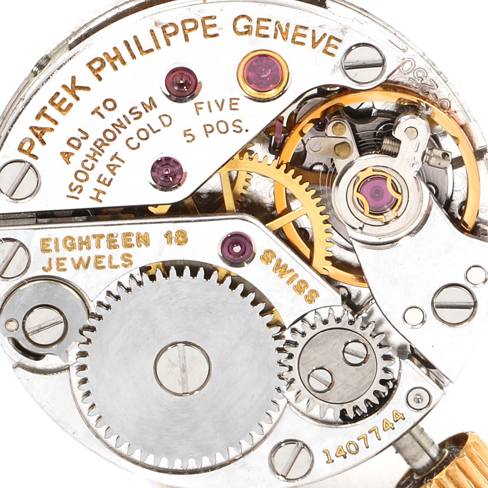 The image shows a close-up view of the movement and internal gears of a Vintage Patek Philippe watch.