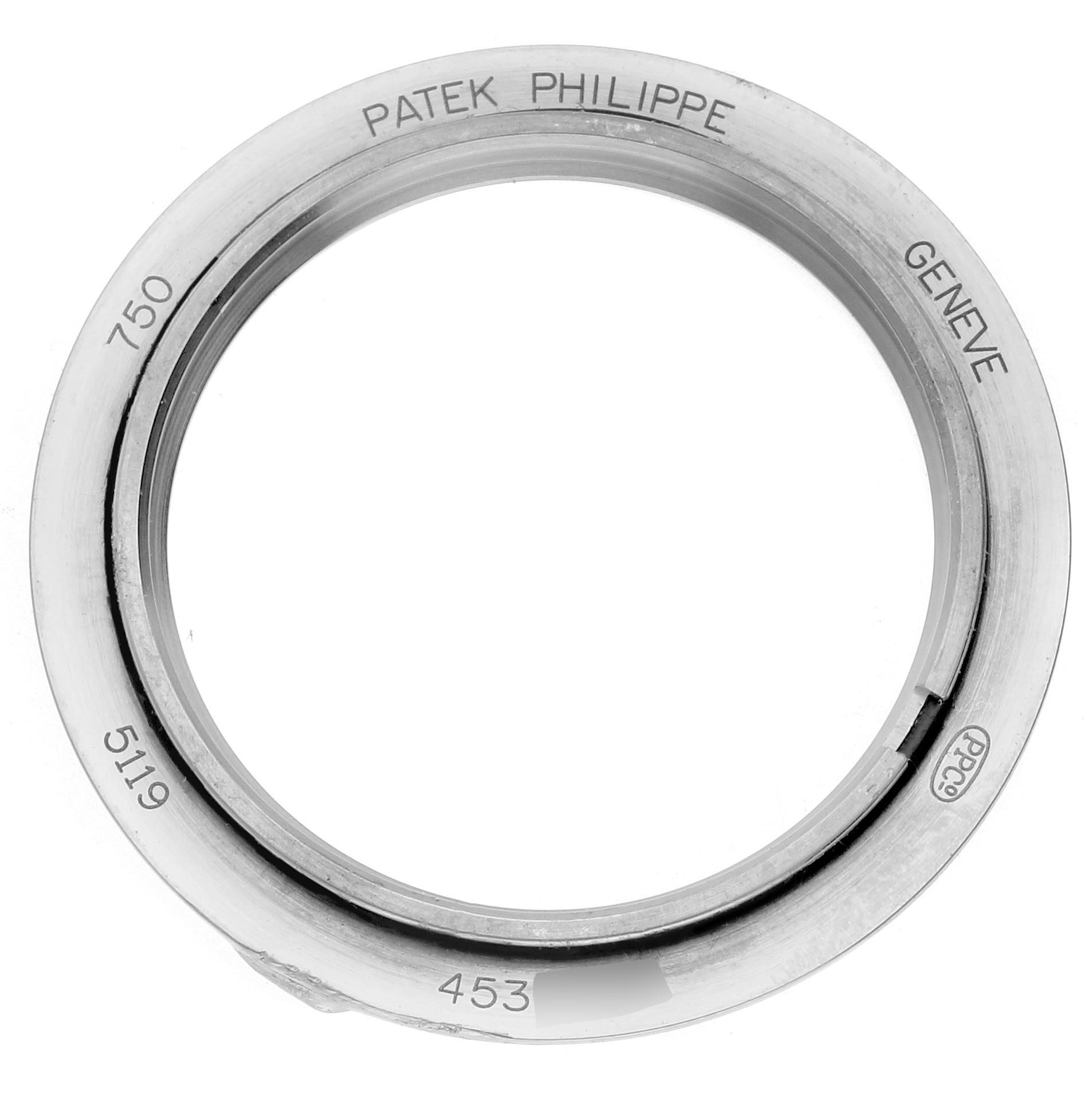 The image shows a top view of a bezel for the Patek Philippe Calatrava 5119G-001 Men's White Gold White Dial 5119G-001 Men's White Gold White Dial model, highlighting engravings.