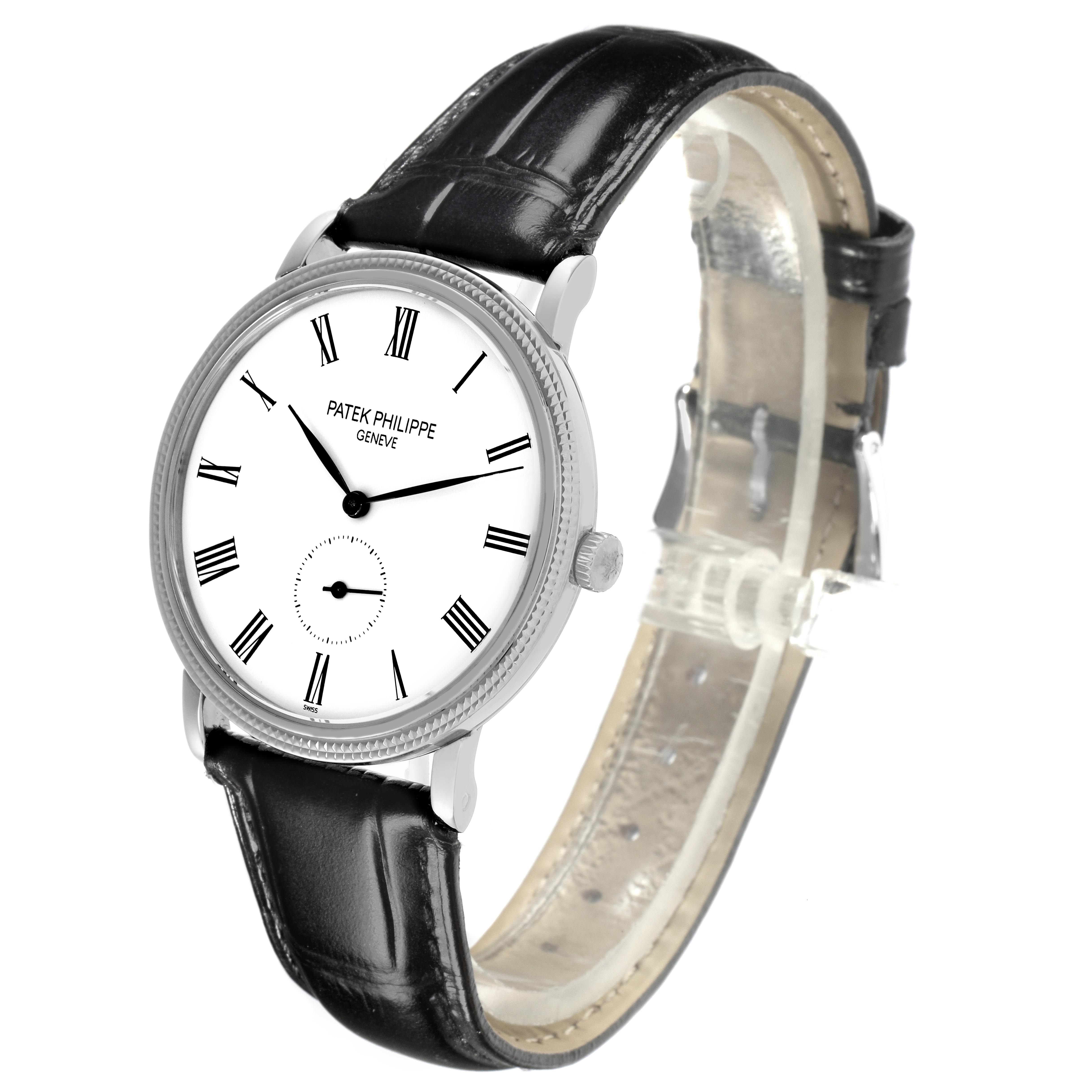 The Patek Philippe Calatrava 5119G-001 Men's White Gold White Dial 5119G-001 Men's White Gold White Dial watch is shown at a three-quarter angle, displaying the dial, crown, and black leather strap.