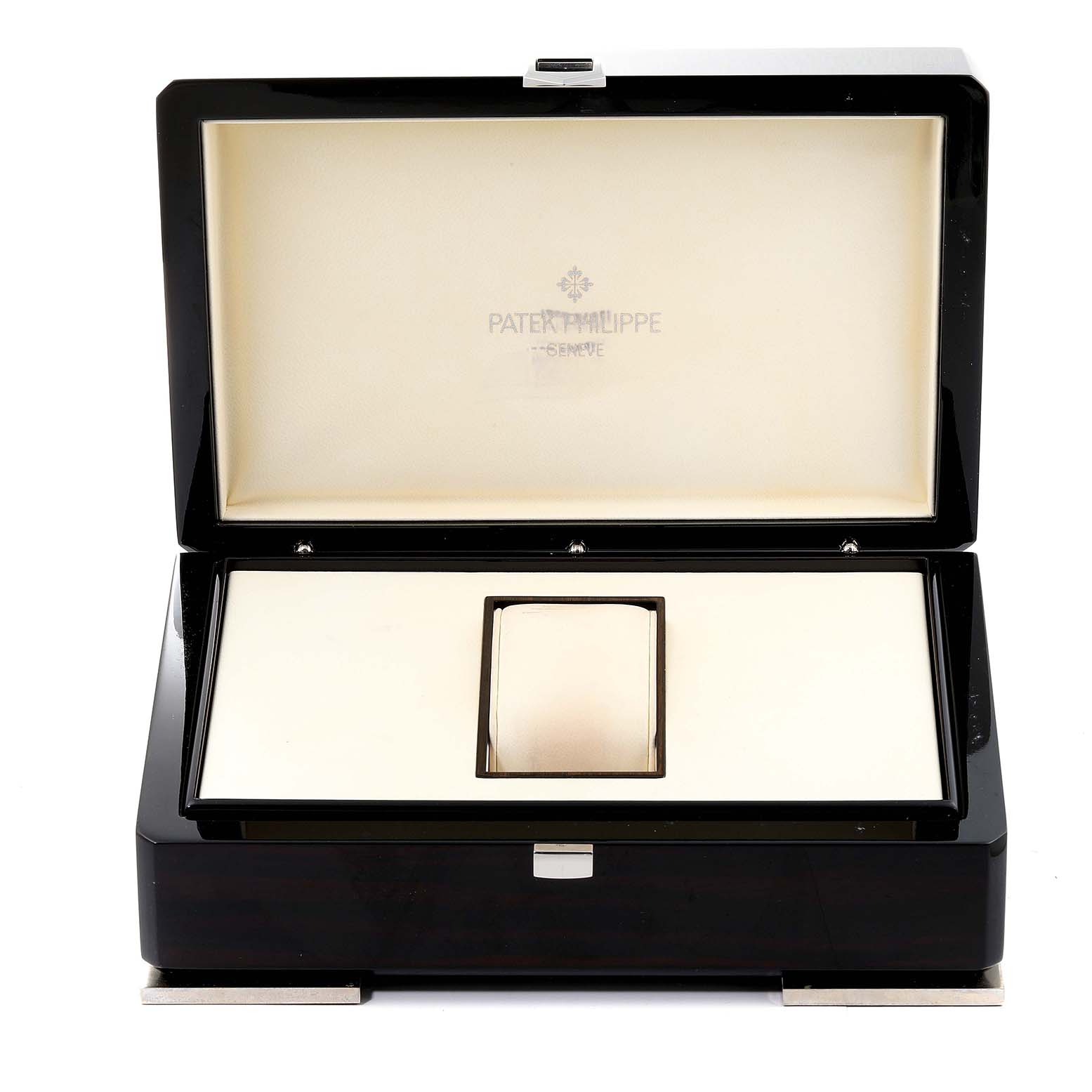 This image shows the opened presentation box of the Patek Philippe Complications 5146G Men's White Gold Beige Dial 5146G Men's White Gold Beige Dial watch with the brand's logo inside the lid.