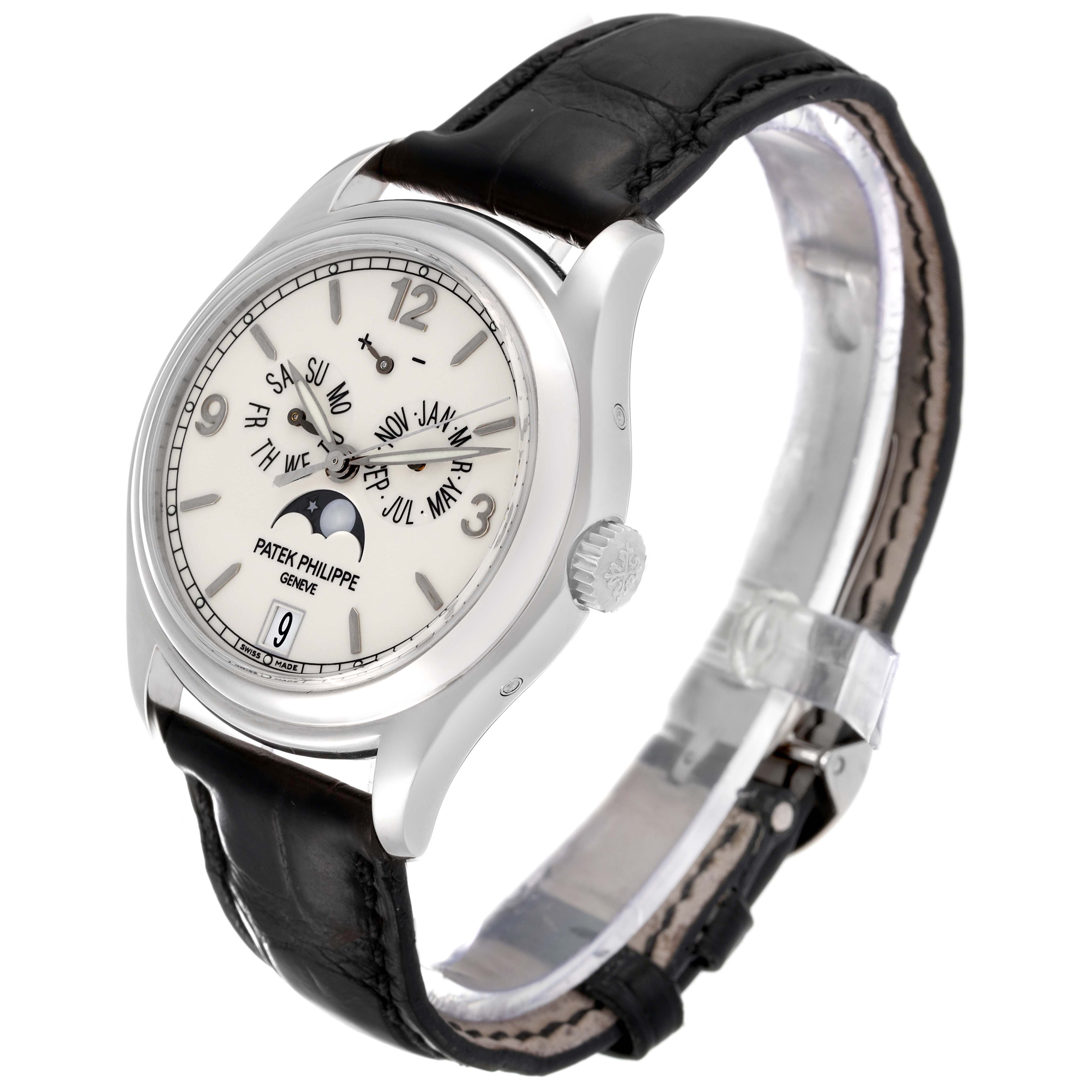 The image shows a Patek Philippe Complications 5146G Men's White Gold Beige Dial 5146G Men's White Gold Beige Dial watch from a side angle, highlighting the face, bezel, crown, and black leather strap.