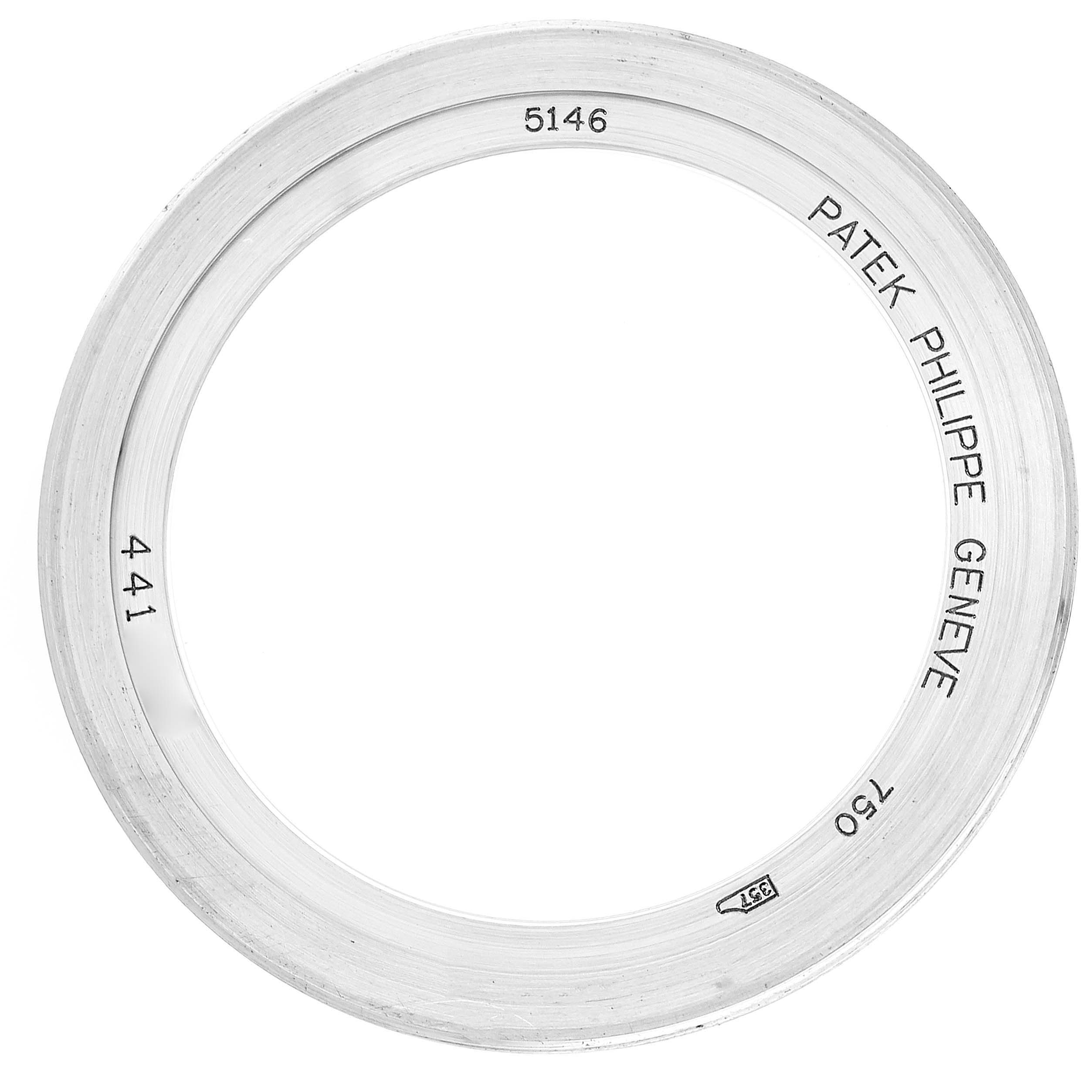 This image shows a bezel from a Patek Philippe Complications 5146G Men's White Gold Beige Dial 5146G Men's White Gold Beige Dial model 5146 watch, viewed from a top-down angle.