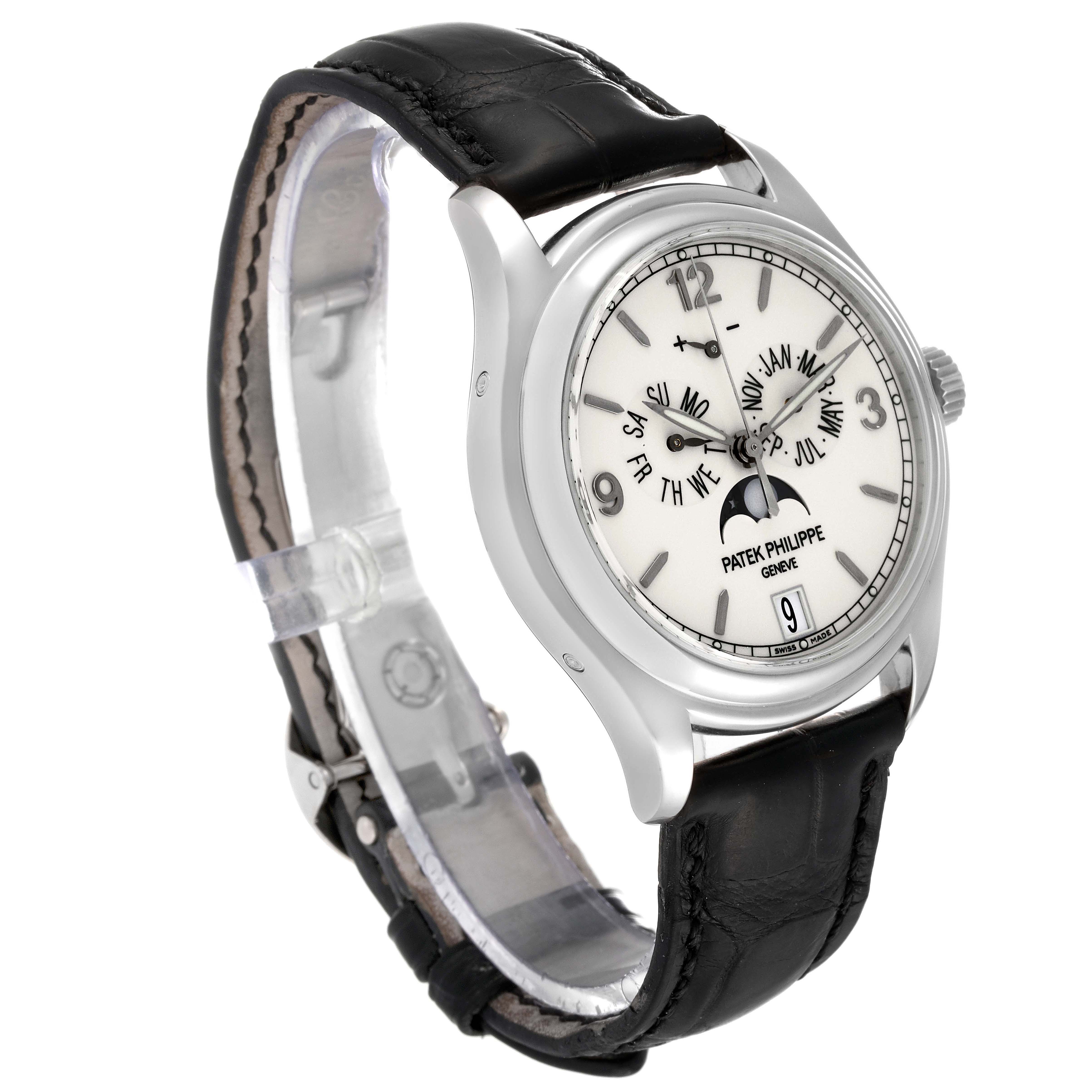 The photo shows a Patek Philippe Complications 5146G Men's White Gold Beige Dial 5146G Men's White Gold Beige Dial watch at a three-quarter angle, highlighting its face, crown, and leather strap.