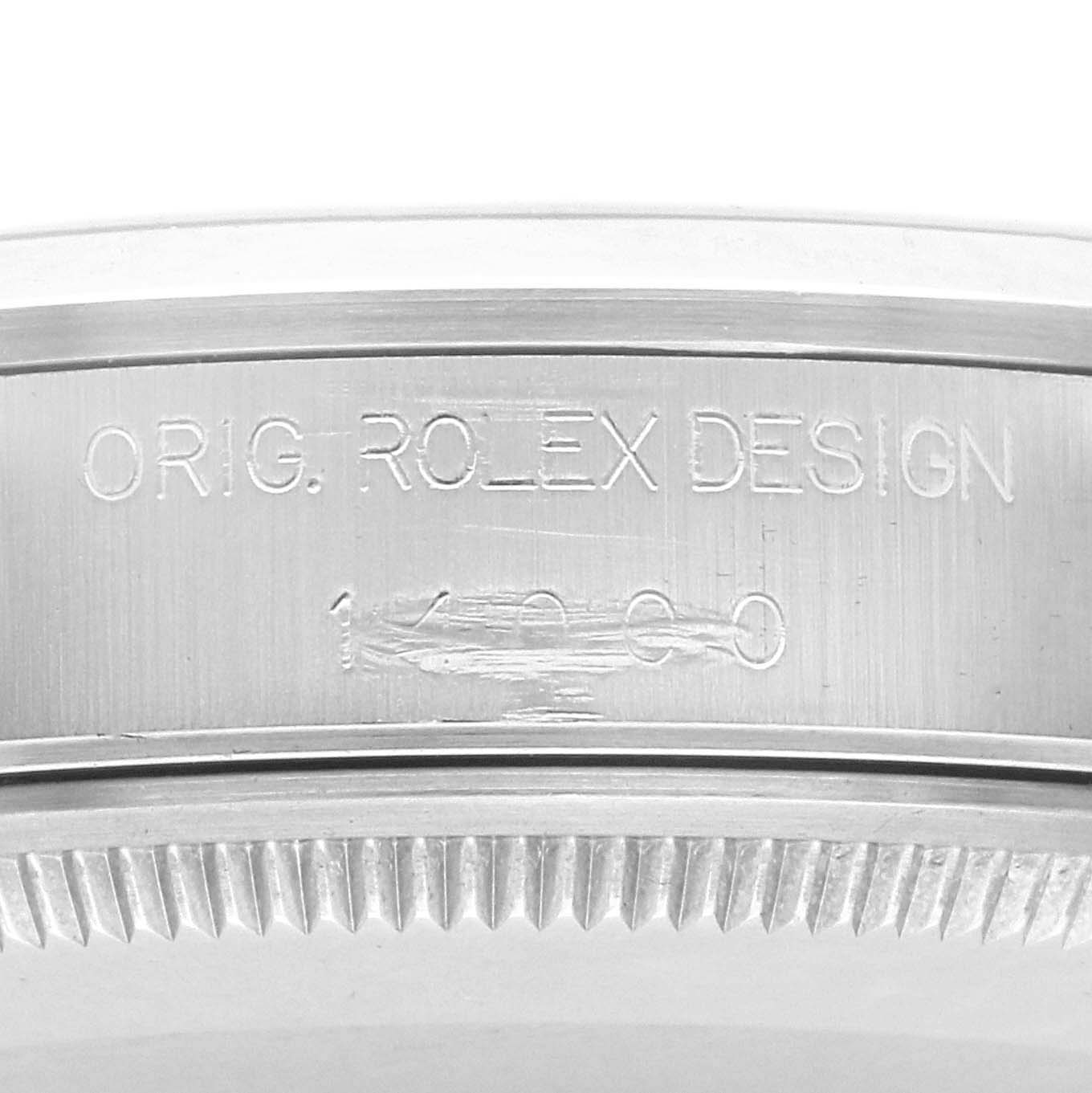 The image shows a close-up of the Rolex Air-King 14000 Men's Stainless Steel Pink Dial 14000 Men's Stainless Steel Pink Dial case side, featuring the "ORIG. ROLEX DESIGN" engraving and part of the bezel.