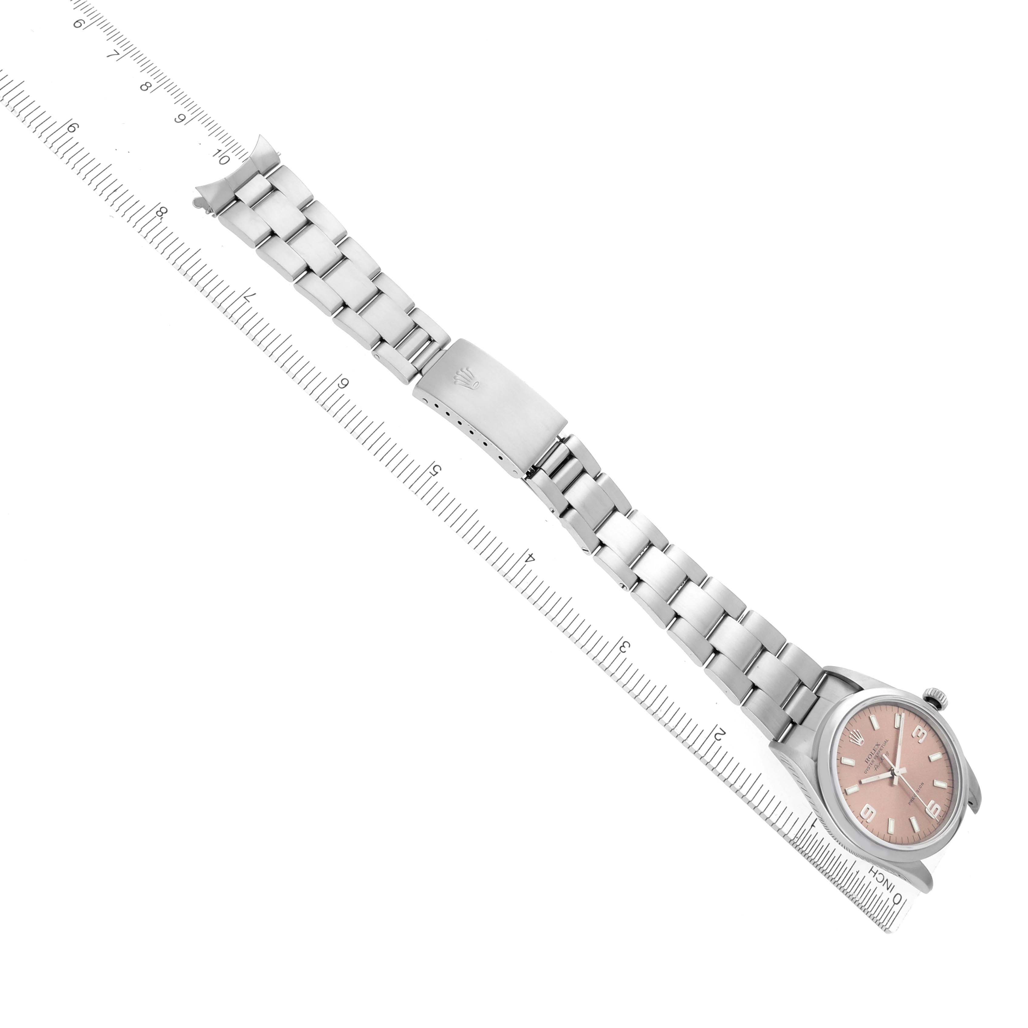 The Rolex Air-King 14000 Men's Stainless Steel Pink Dial 14000 Men's Stainless Steel Pink Dial watch is shown from an angled top view, displaying the full bracelet and dial next to a ruler.