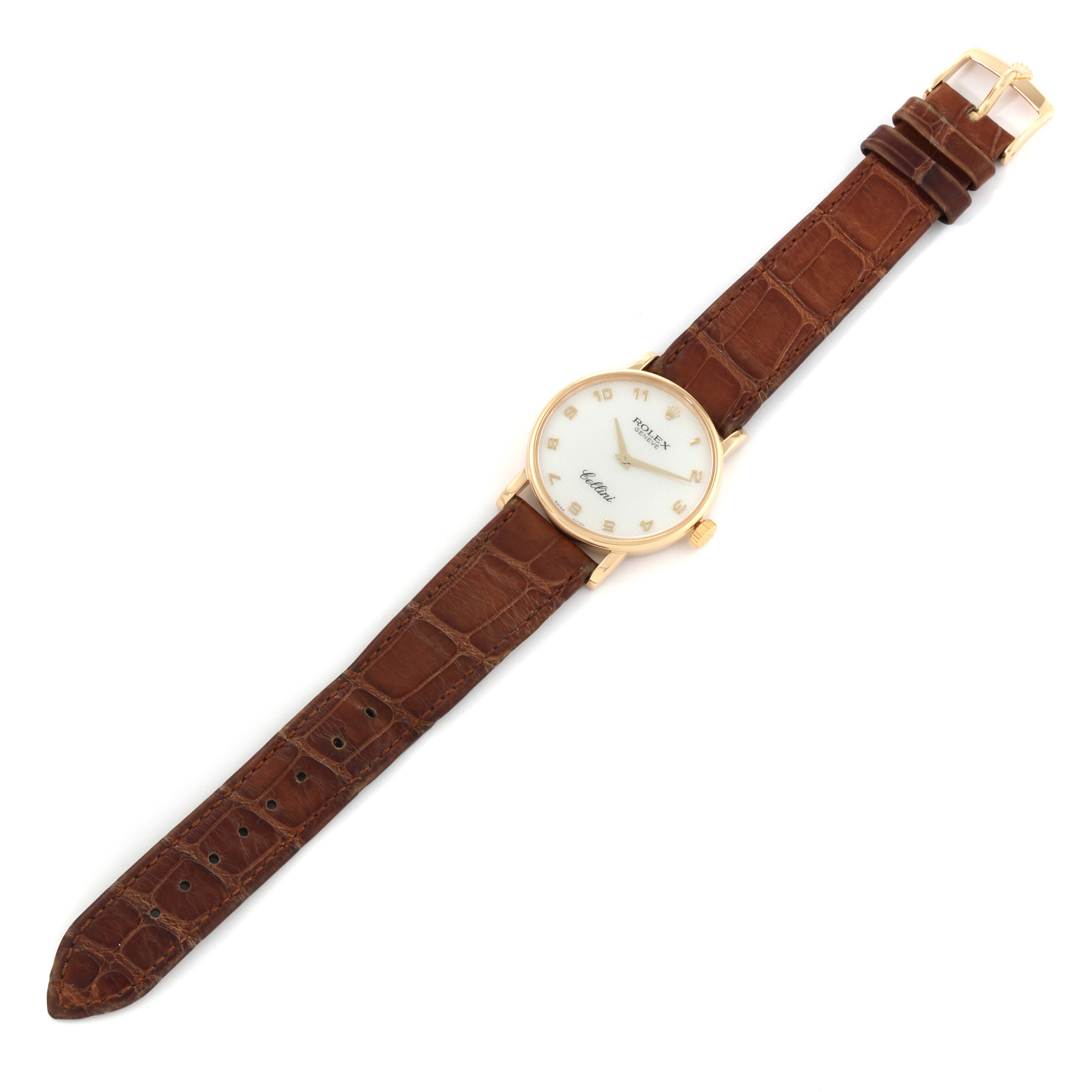 This image shows a Rolex Cellini 5115 Men
s Yellow Gold Mother of Pearl Dial 5115 Men
s Yellow Gold Mother of Pearl Dial watch from a top view, featuring its round face, gold casing, and brown leather strap.