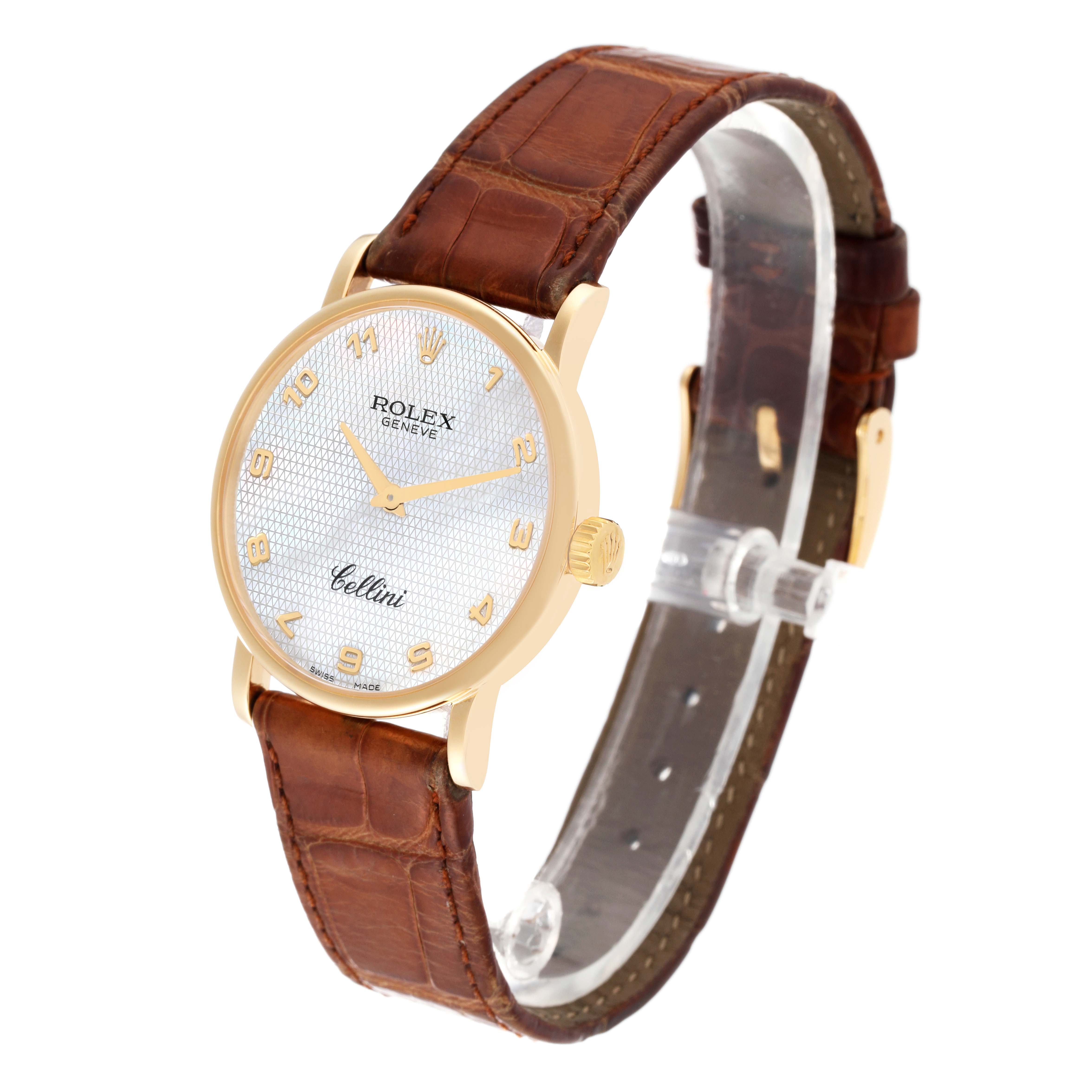 The Rolex Cellini 5115 Men
s Yellow Gold Mother of Pearl Dial 5115 Men
s Yellow Gold Mother of Pearl Dial watch is shown at an angle displaying the face, bezel, case, crown, and leather strap.