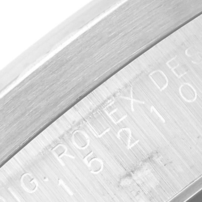 This image shows the engraved side of the case band of a Rolex Date 15210 Men's Stainless Steel Blue Dial 15210 Men's Stainless Steel Blue Dial model, displaying part of the model number and branding.