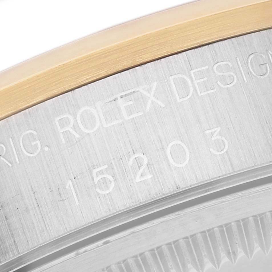 This image shows a close-up of the model number engraved on the side of the Rolex Date 15203 Men's Steel and Gold (two tone) White Dial 15203 Men's Steel and Gold (two tone) White Dial watch case.