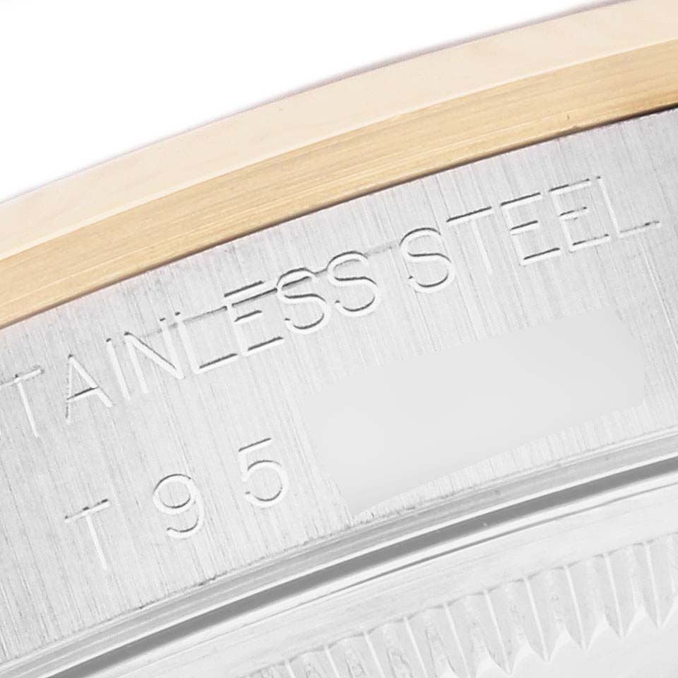 The image shows a close-up of the rim and engravings on the case back of a Rolex Date 15203 Men's Steel and Gold (two tone) White Dial 15203 Men's Steel and Gold (two tone) White Dial model watch.