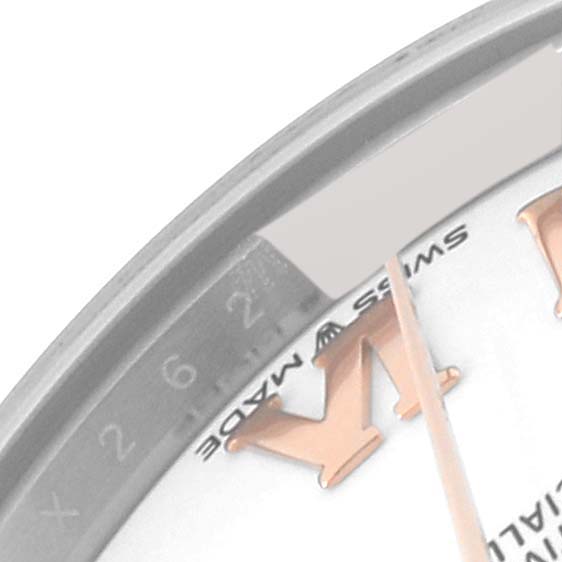 This close-up view of the Rolex Mid-Size 278271 Women's Steel and Gold (two tone) White Dial 278271 Women's Steel and Gold (two tone) White Dial model shows the watch dial, including part of the Roman numeral "XII" and the date indicator.