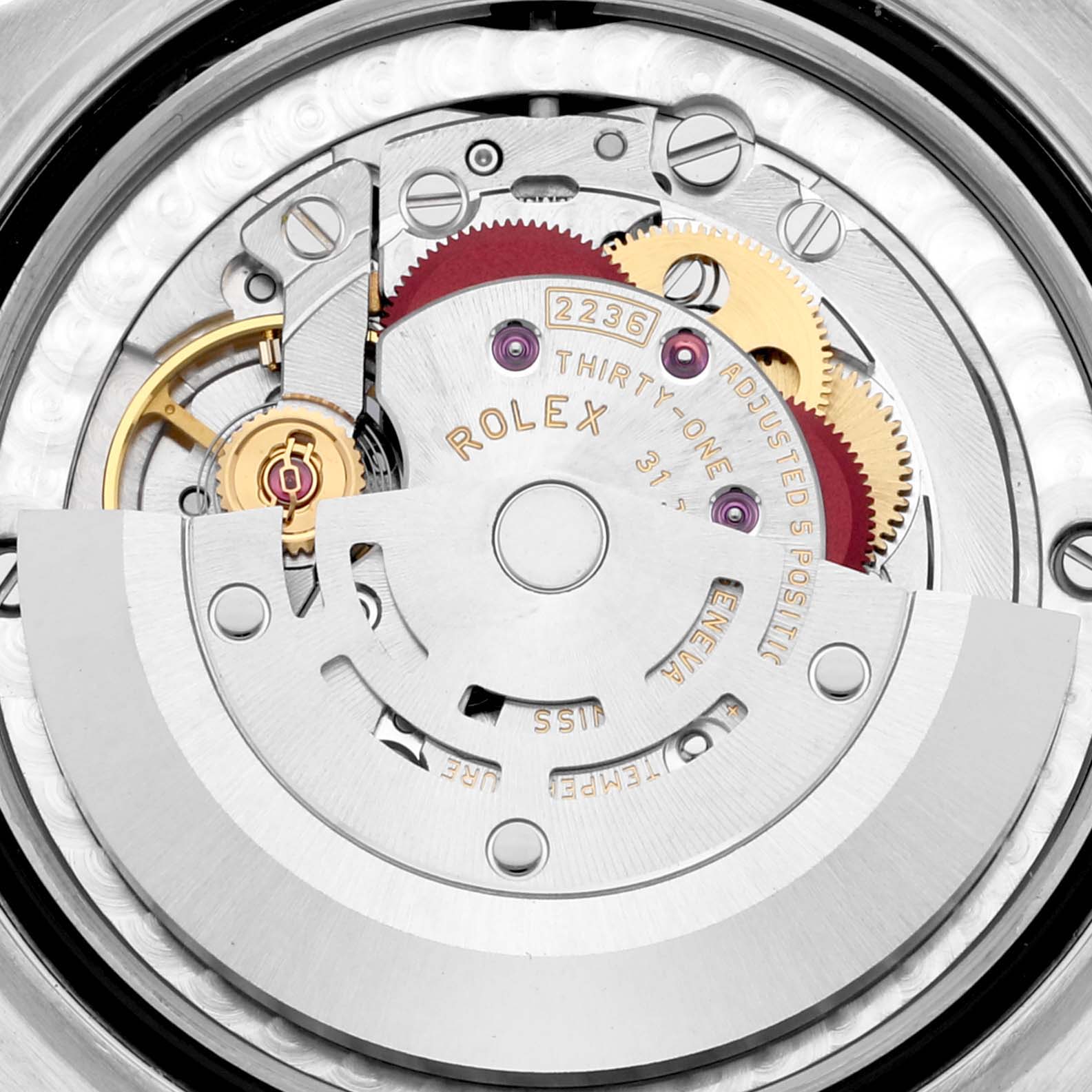 This image shows the internal movement components of the Rolex Mid-Size 278271 Women's Steel and Gold (two tone) White Dial 278271 Women's Steel and Gold (two tone) White Dial watch, highlighting gears and the rotor mechanism.
