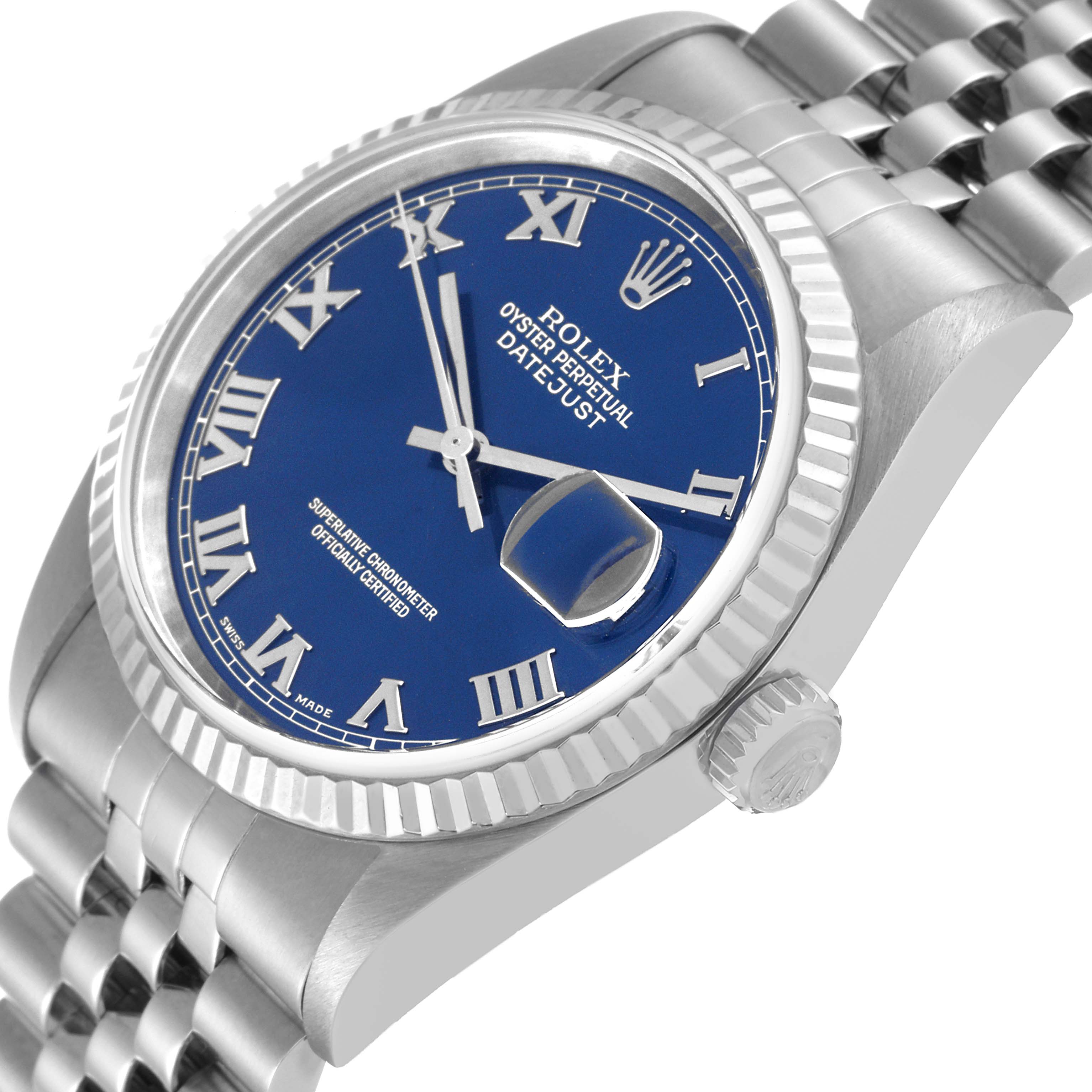 This image shows a close-up angled view of the Rolex Datejust 16234 Men's Stainless Steel Blue Dial 16234 Men's Stainless Steel Blue Dial watch, highlighting the blue dial, Roman numerals, and fluted bezel.