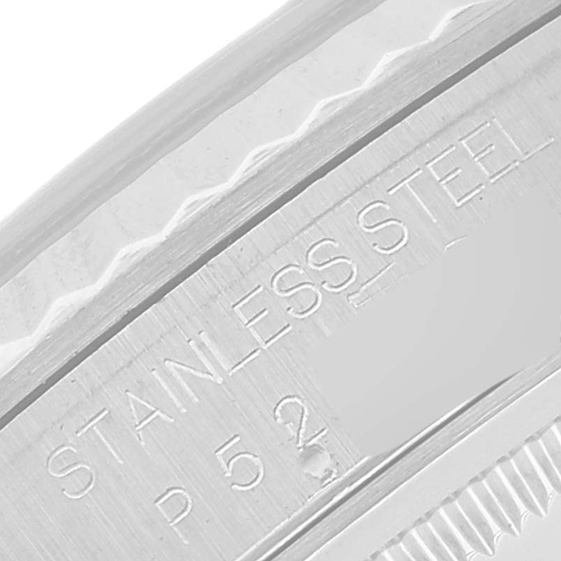 The image shows a close-up of the engraved "STAINLESS STEEL" text on the case back of a Rolex Datejust 16234 Men's Stainless Steel Blue Dial 16234 Men's Stainless Steel Blue Dial watch.