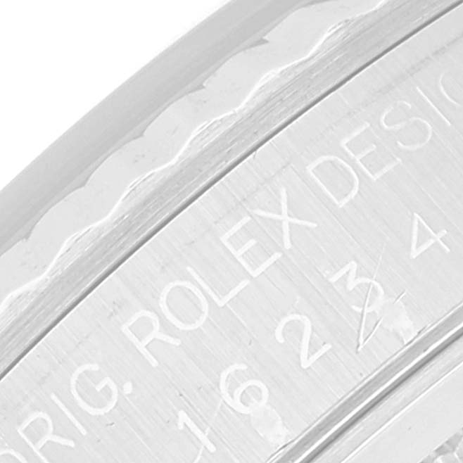 The image shows a close-up of the engraved inner bezel of the Rolex Datejust 16234 Men's Stainless Steel Blue Dial 16234 Men's Stainless Steel Blue Dial watch.