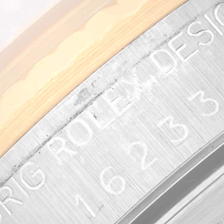 This image shows a close-up of the case back with engraved model number for a Rolex Datejust 16233 Men's Steel and Gold (two tone) Black Dial 16233 Men's Steel and Gold (two tone) Black Dial watch.