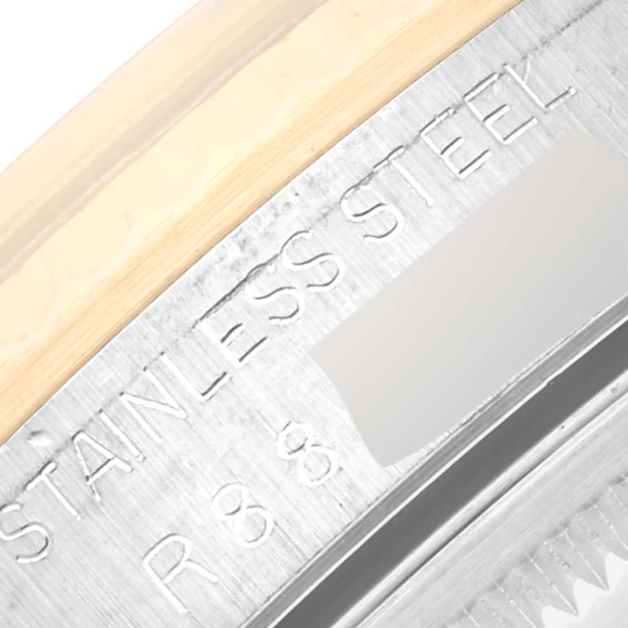 The image shows an angled close-up of the bezel and outer edge of a Rolex Datejust 16233 Men's Steel and Gold (two tone) Black Dial 16233 Men's Steel and Gold (two tone) Black Dial watch, highlighting the "Stainless Steel" text.