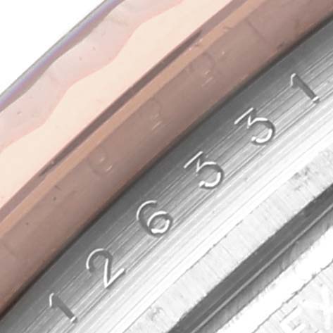 The image shows a close-up of the serial number engraving on the side of a Rolex Datejust 41 126331 Men
s Steel and Gold (two tone) Brown Dial 126331 Men
s Steel and Gold (two tone) Brown Dial
s case.