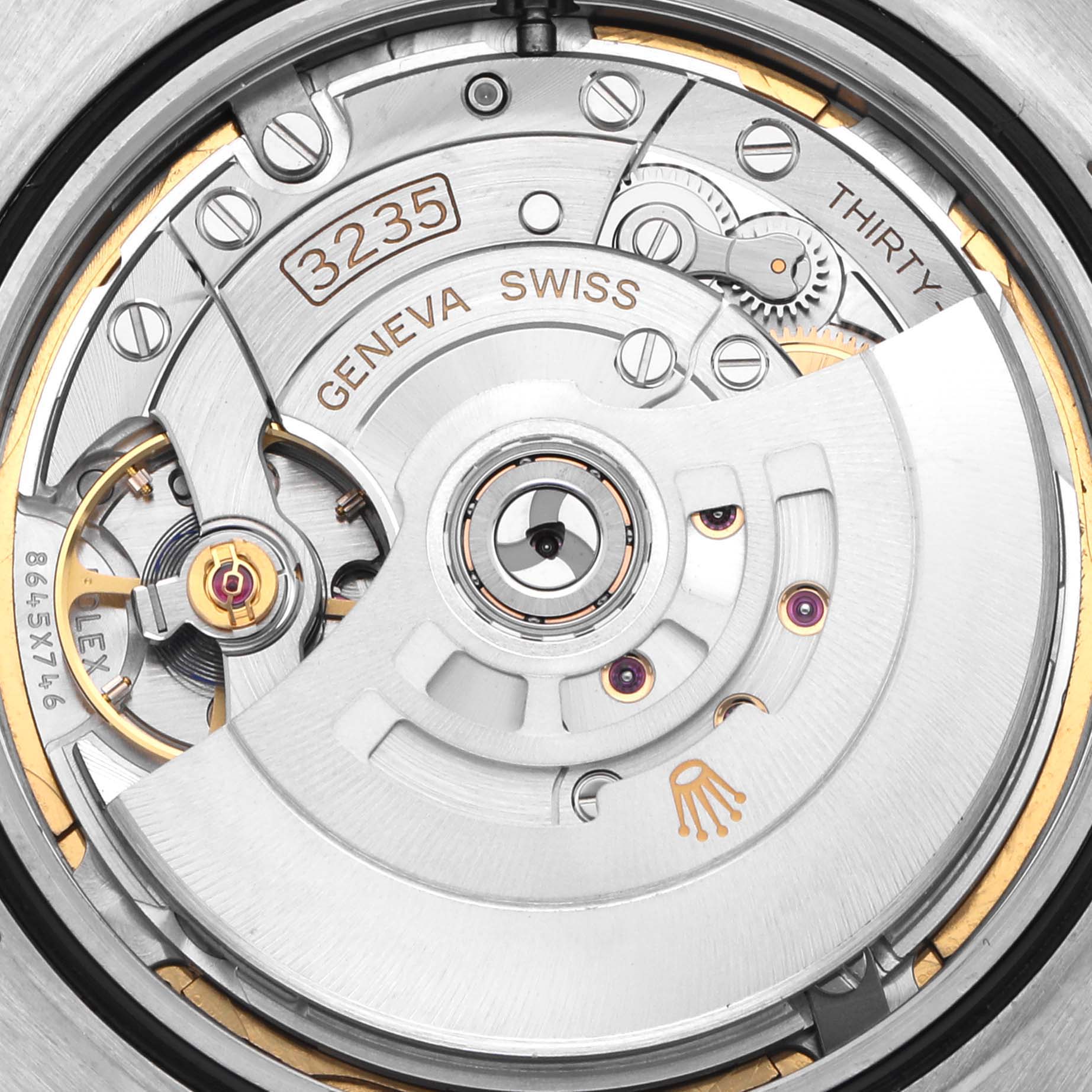 The image shows the Rolex Datejust 41 126331 Men
s Steel and Gold (two tone) Brown Dial 126331 Men
s Steel and Gold (two tone) Brown Dial movement, showcasing its intricate internal mechanisms.