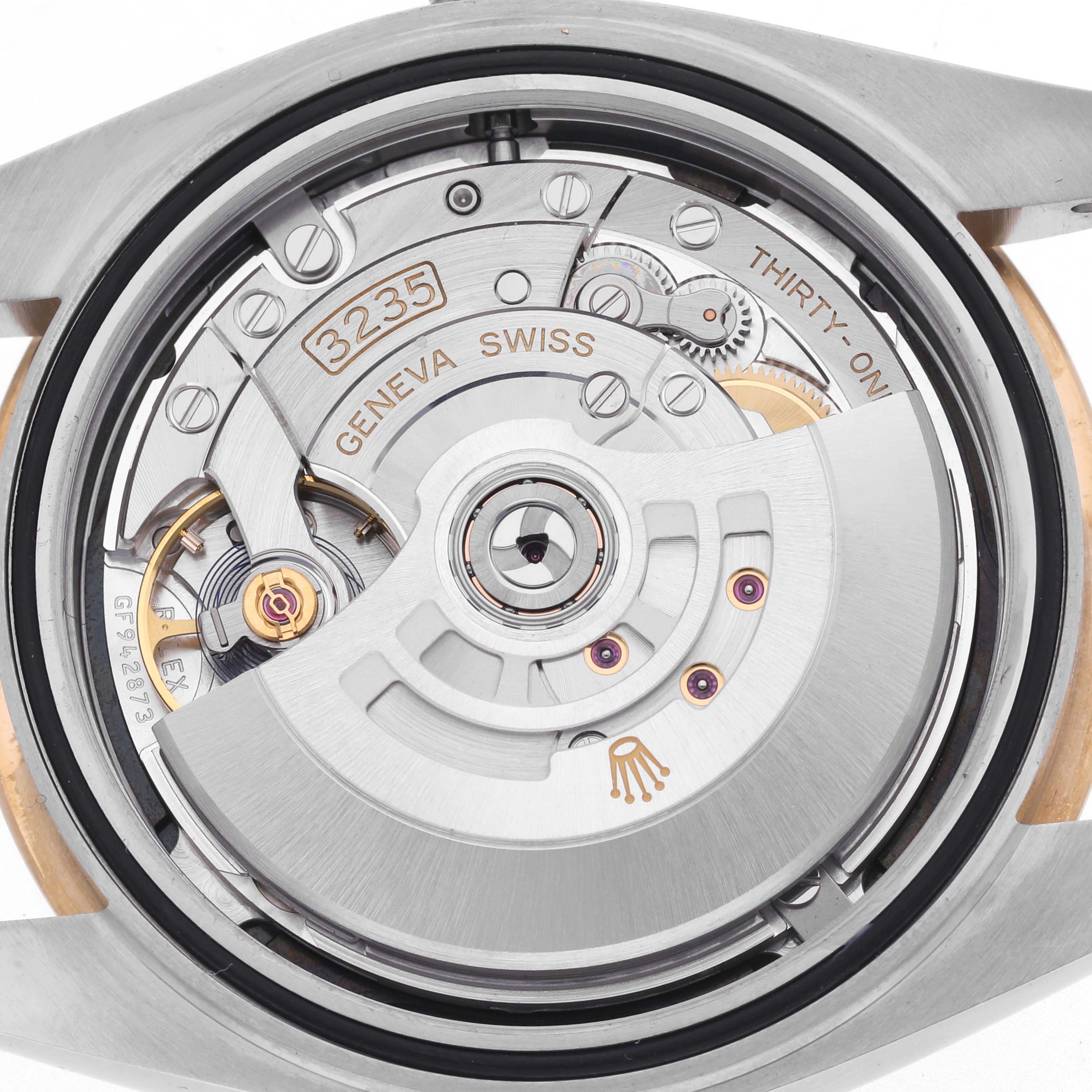 The image shows the movement mechanism of the Rolex Datejust 41 126333 Men's Steel and Gold (two tone) Black Dial 126333 Men's Steel and Gold (two tone) Black Dial, viewed from the back, highlighting the rotor and gears.