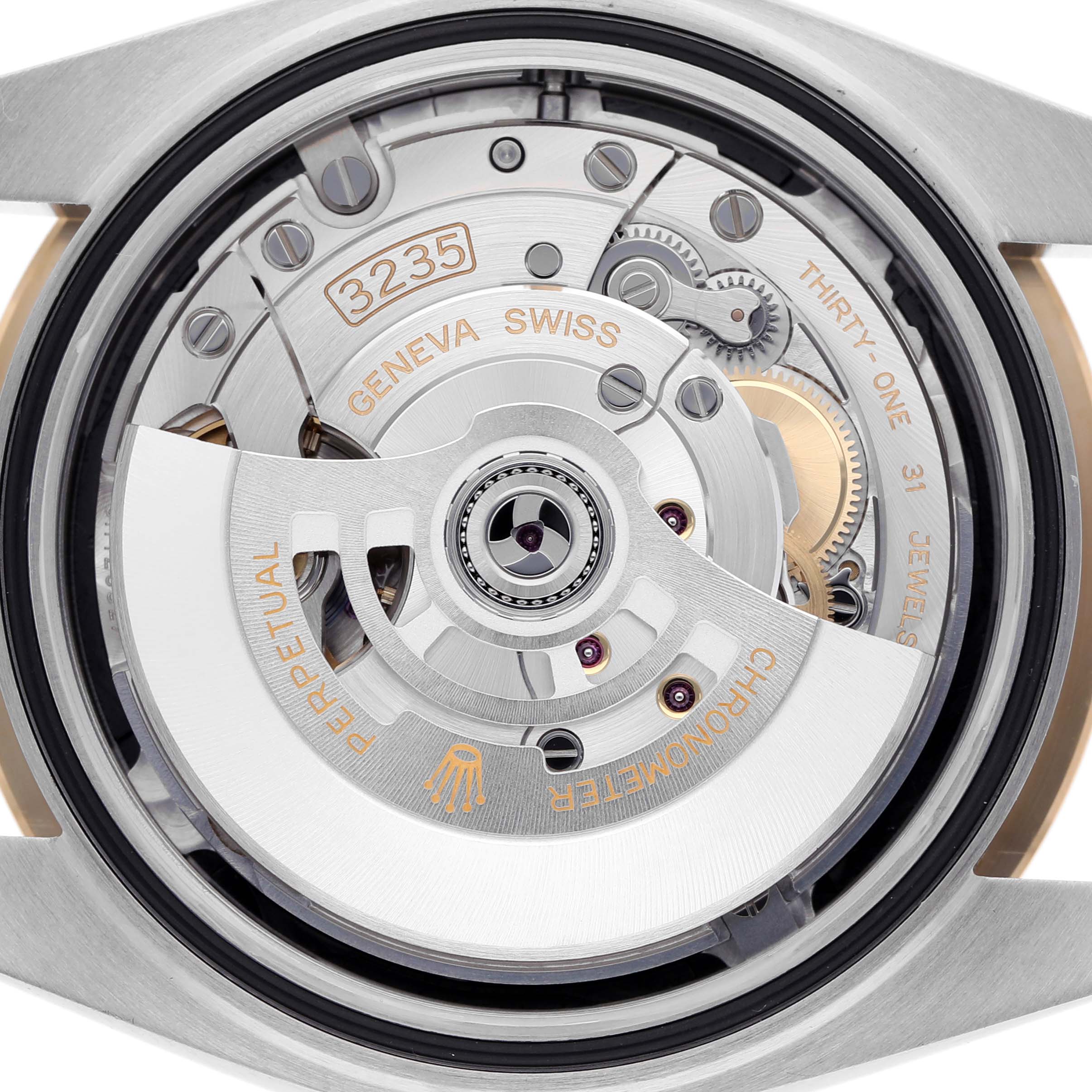 This image shows the movement of a Rolex Datejust 41 126303 Men's Steel and Gold (two tone) Black Dial 126303 Men's Steel and Gold (two tone) Black Dial, viewed from the back.