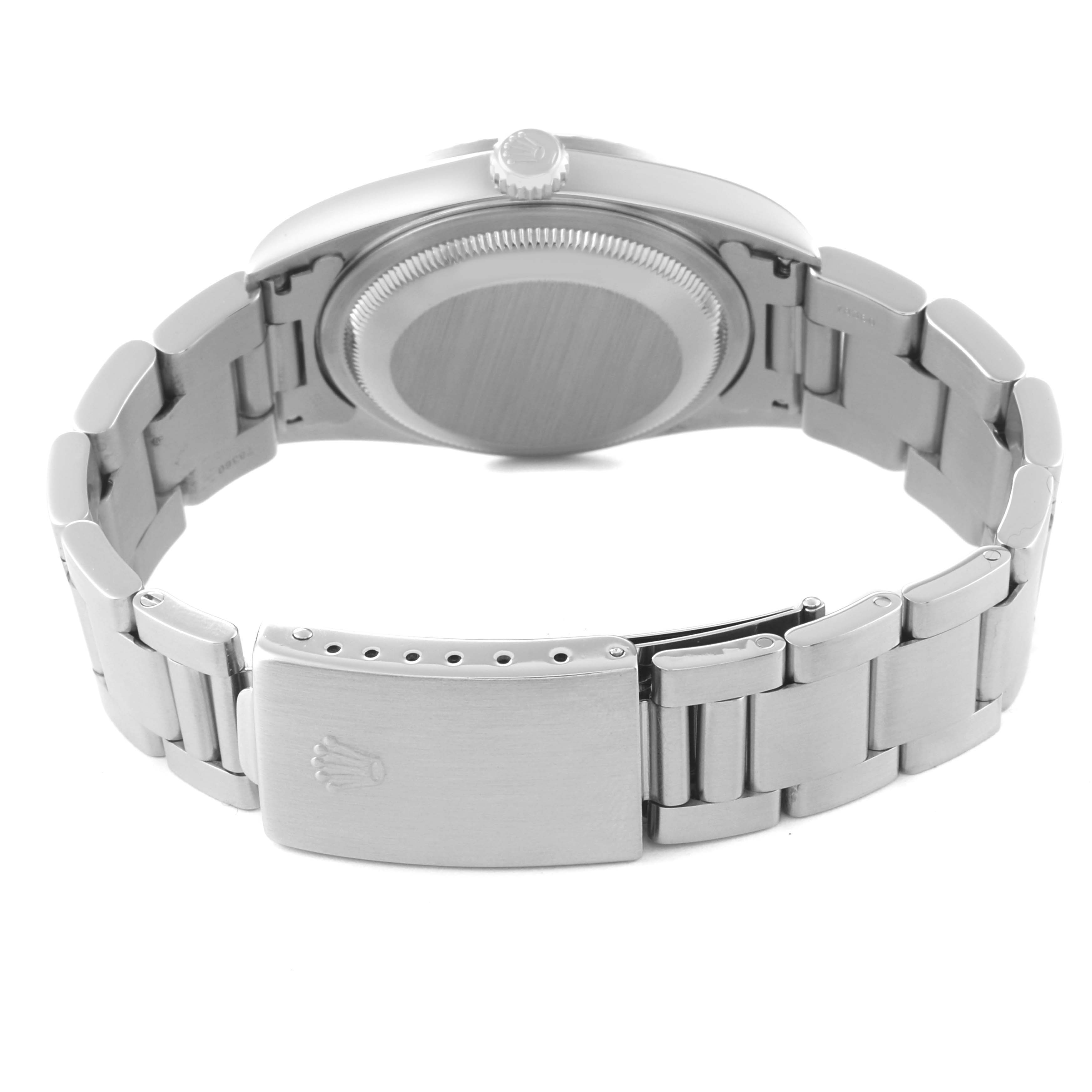 The image shows the back and clasp of a Rolex Datejust 16220 Men's Stainless Steel Blue Dial 16220 Men's Stainless Steel Blue Dial watch, including the case back, bracelet, and crown logo on the clasp.