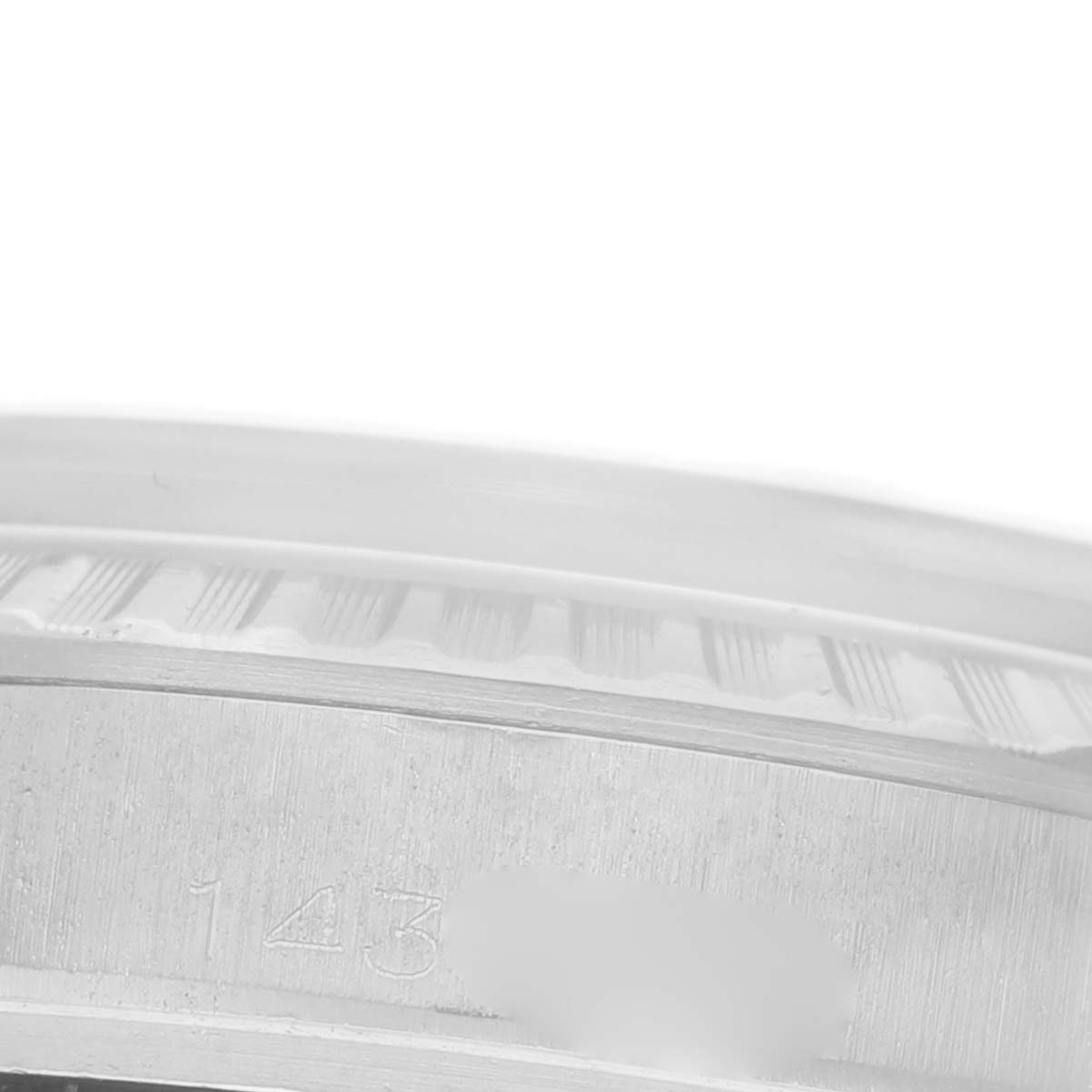 The image shows a close-up view of the case and fluted bezel edge of a Rolex Datejust 1603 Men's Stainless Steel Blue Dial 1603 Men's Stainless Steel Blue Dial watch.