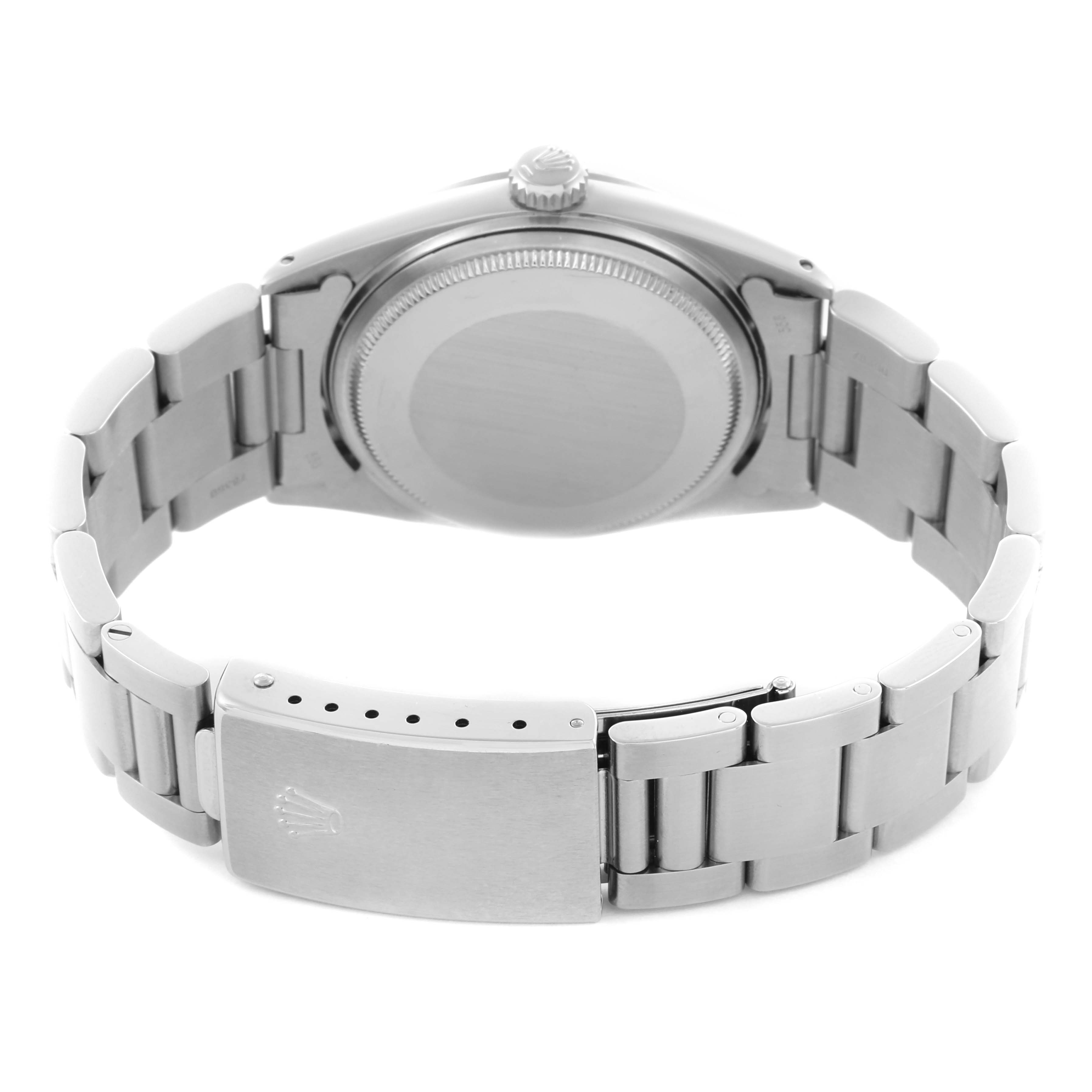 The Rolex Datejust 1603 Men's Stainless Steel Blue Dial 1603 Men's Stainless Steel Blue Dial is shown from the back, highlighting the case back, crown, and bracelet clasp.