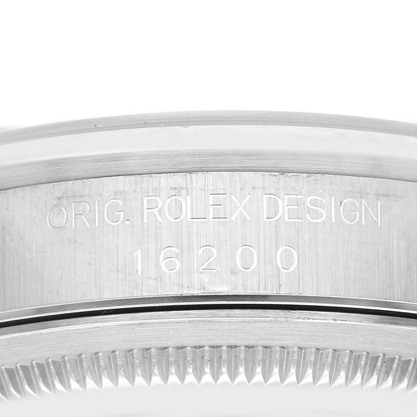 The image shows a close-up of the side and bezel of a Rolex Datejust 16200 Men's Stainless Steel Blue Dial 16200 Men's Stainless Steel Blue Dial model 16200 watch, featuring the engraved text.