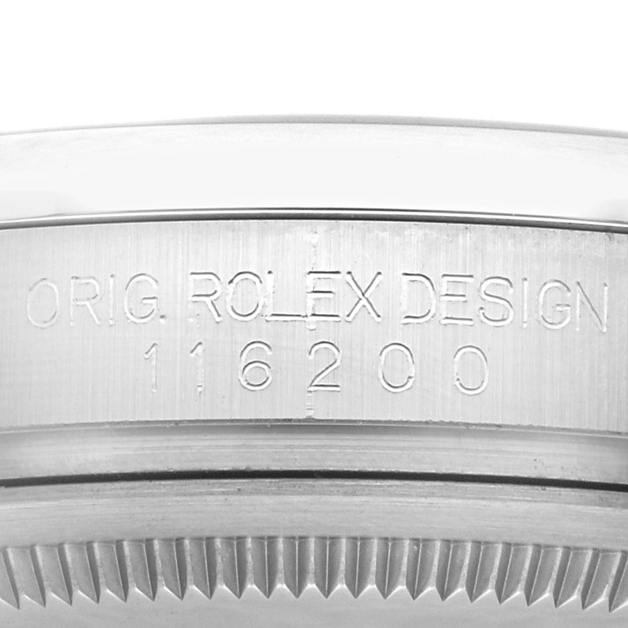 This image shows an up-close view of the model and serial number engraving on the Rolex Datejust 116200 Men's Stainless Steel Blue Dial 116200 Men's Stainless Steel Blue Dial watch case.