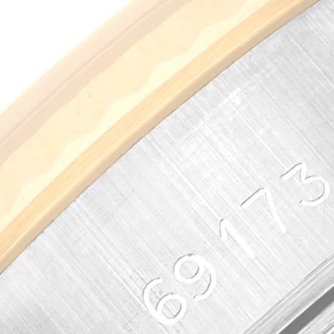 This image shows a close-up of the serial number engraved on the case of a Rolex Datejust 69173 Women's Steel and Gold (two tone) Champagne Dial 69173 Women's Steel and Gold (two tone) Champagne Dial watch.