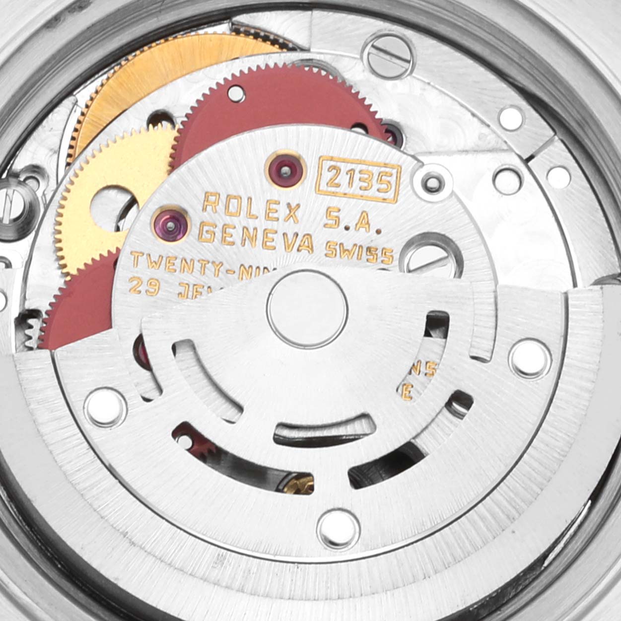This image shows the intricate inner mechanism of a Rolex Datejust 69173 Women's Steel and Gold (two tone) Champagne Dial 69173 Women's Steel and Gold (two tone) Champagne Dial watch, highlighting its gears and rotor.