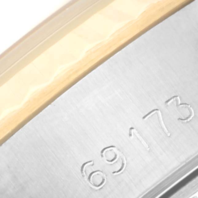 This close-up image shows part of the bezel and case with the model number "69173" of a Rolex Datejust 69173 Women's Steel and Gold (two tone) Champagne Dial 69173 Women's Steel and Gold (two tone) Champagne Dial watch.